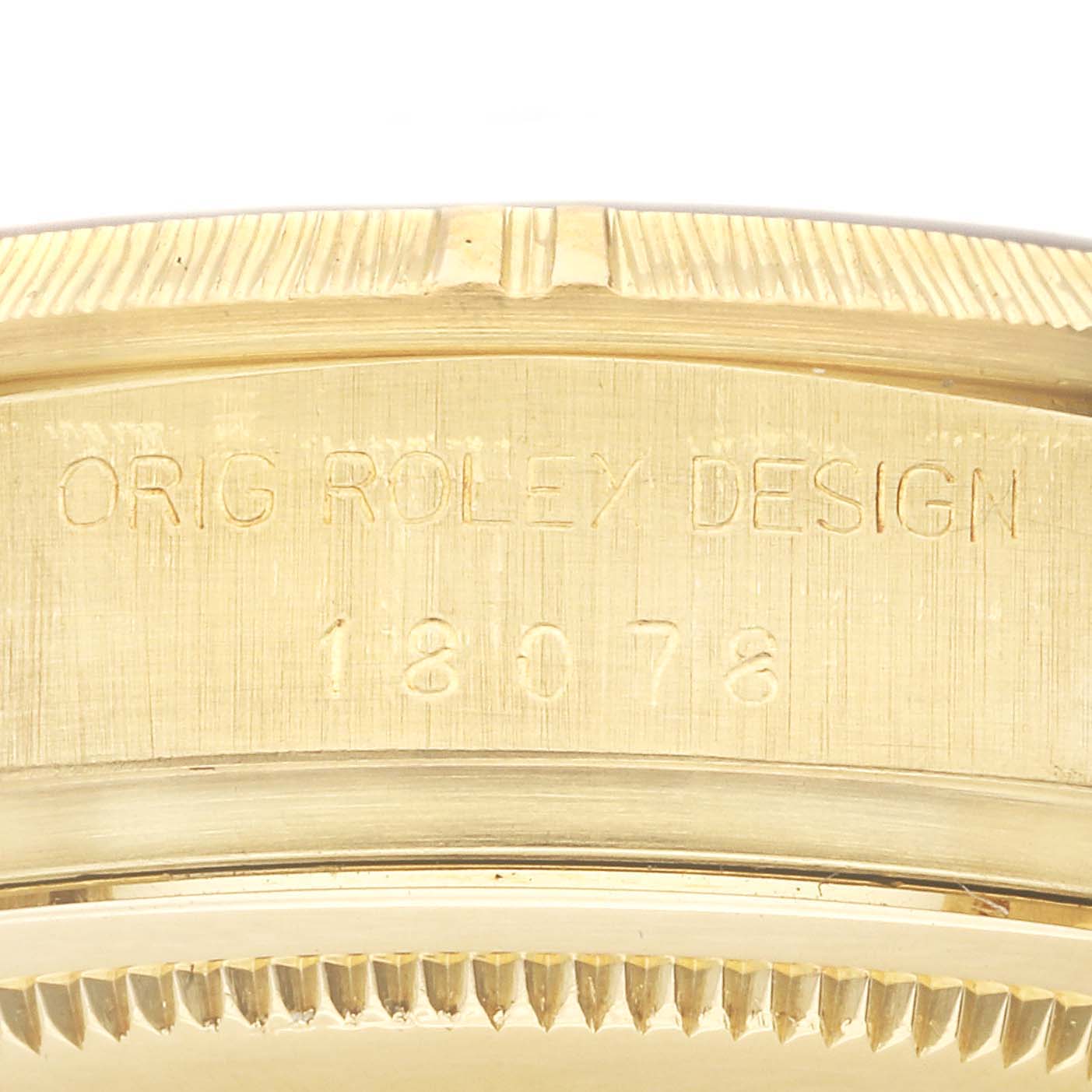 This image shows a close-up view of the caseback and model number of a Rolex President 18078 Men
s Yellow Gold Black Dial 18078 Men
s Yellow Gold Black Dial watch.