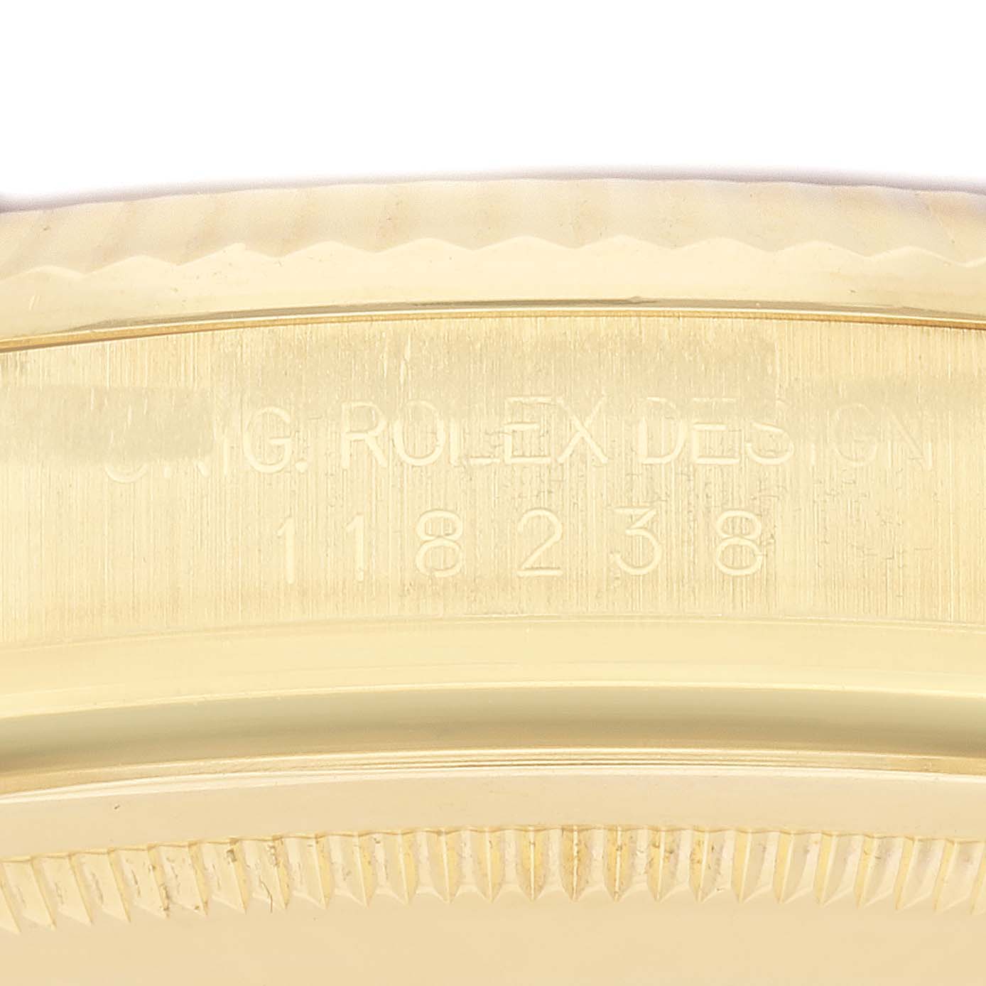 The image shows an engraving on the side of the bezel or case of a Rolex President 118238 Men
s Yellow Gold Blue Dial 118238 Men
s Yellow Gold Blue Dial watch, displaying its model number.