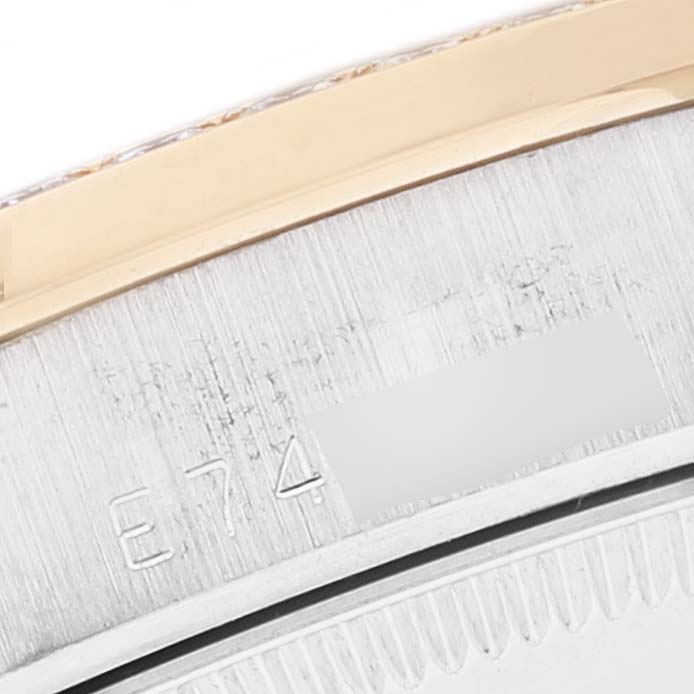 This is a close-up shot of the serial number area on the Rolex President 68289 Women's Steel and Gold (two tone) Brown Dial 68289 Women's Steel and Gold (two tone) Brown Dial model watch.