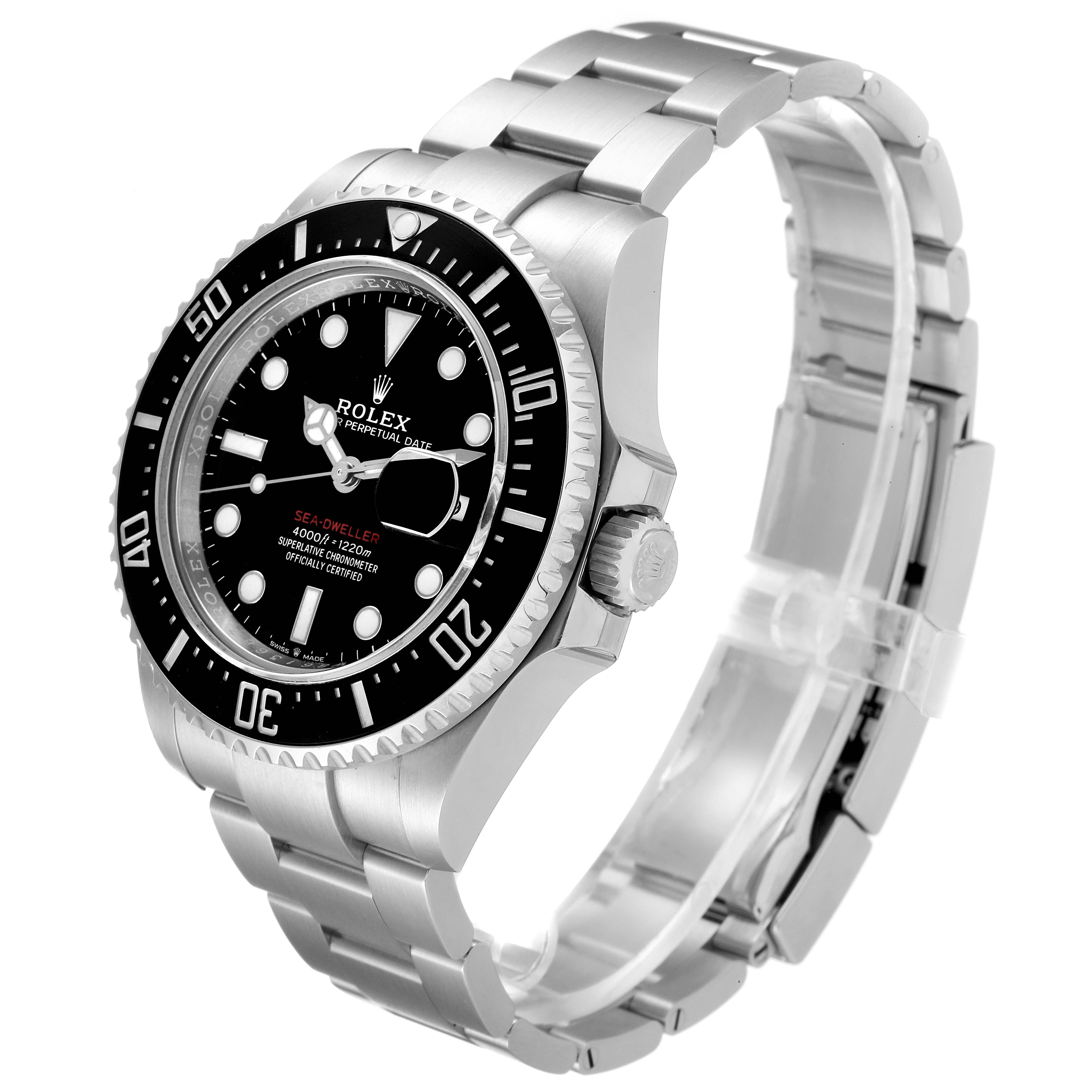 The image shows a side-angle view of the Rolex Sea-Dweller 126600 Men
s Stainless Steel Black Dial 126600 Men
s Stainless Steel Black Dial watch, detailing its bezel, dial, and metal bracelet.