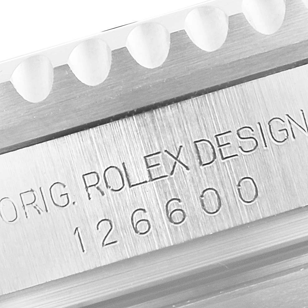 This close-up image shows the engraved side of the bezel and case of a Rolex Sea-Dweller 126600 Men
s Stainless Steel Black Dial 126600 Men
s Stainless Steel Black Dial model.