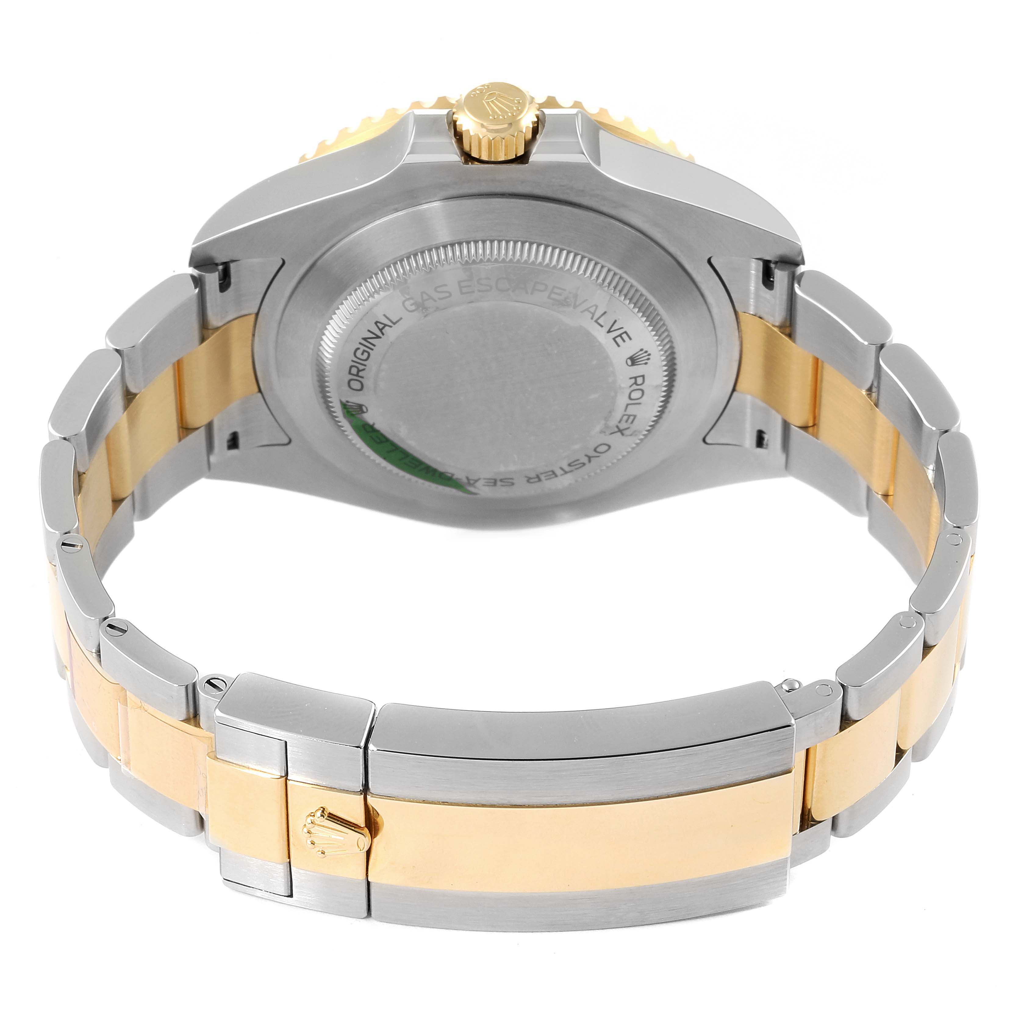 The image shows the back, crown, and bracelet of a Rolex Sea-Dweller 126603 Men
s Steel and Gold (two tone) Black Dial 126603 Men
s Steel and Gold (two tone) Black Dial watch in a two-tone metal finish.