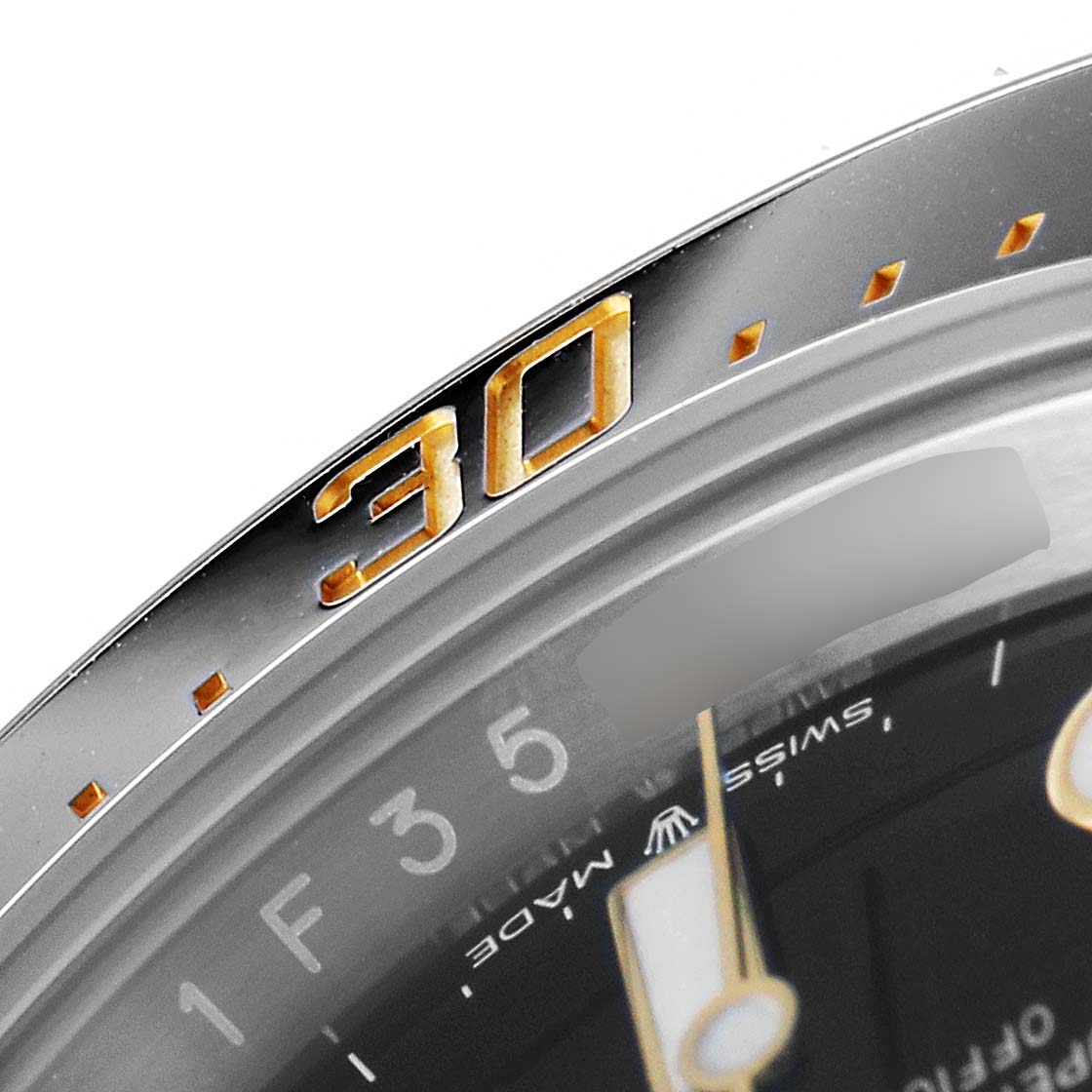 The image shows a close-up of the bezel and part of the dial of a Rolex Sea-Dweller 126603 Men
s Steel and Gold (two tone) Black Dial 126603 Men
s Steel and Gold (two tone) Black Dial watch, highlighting the "30" minute marker.