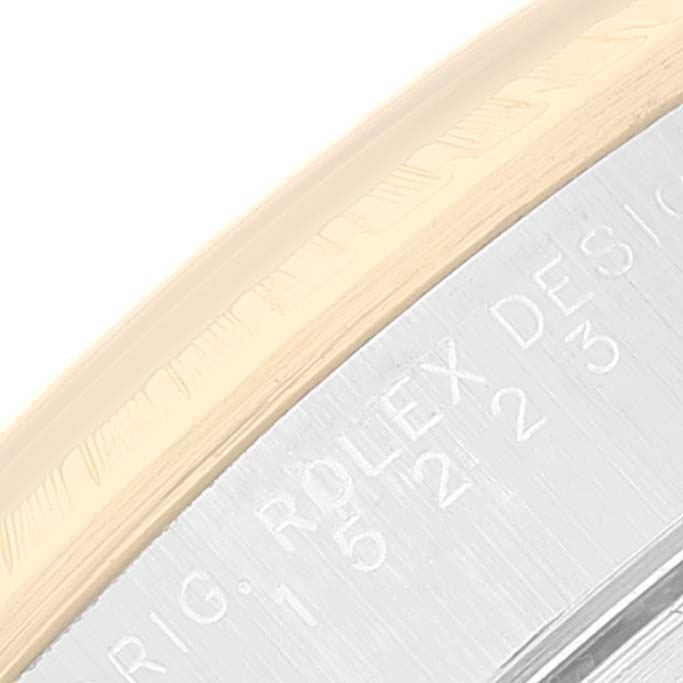 The image shows a close-up of the bezel and part of the engraved case back of a Rolex Date 15223 Men's Steel and Gold (two tone) Black Dial 15223 Men's Steel and Gold (two tone) Black Dial watch.