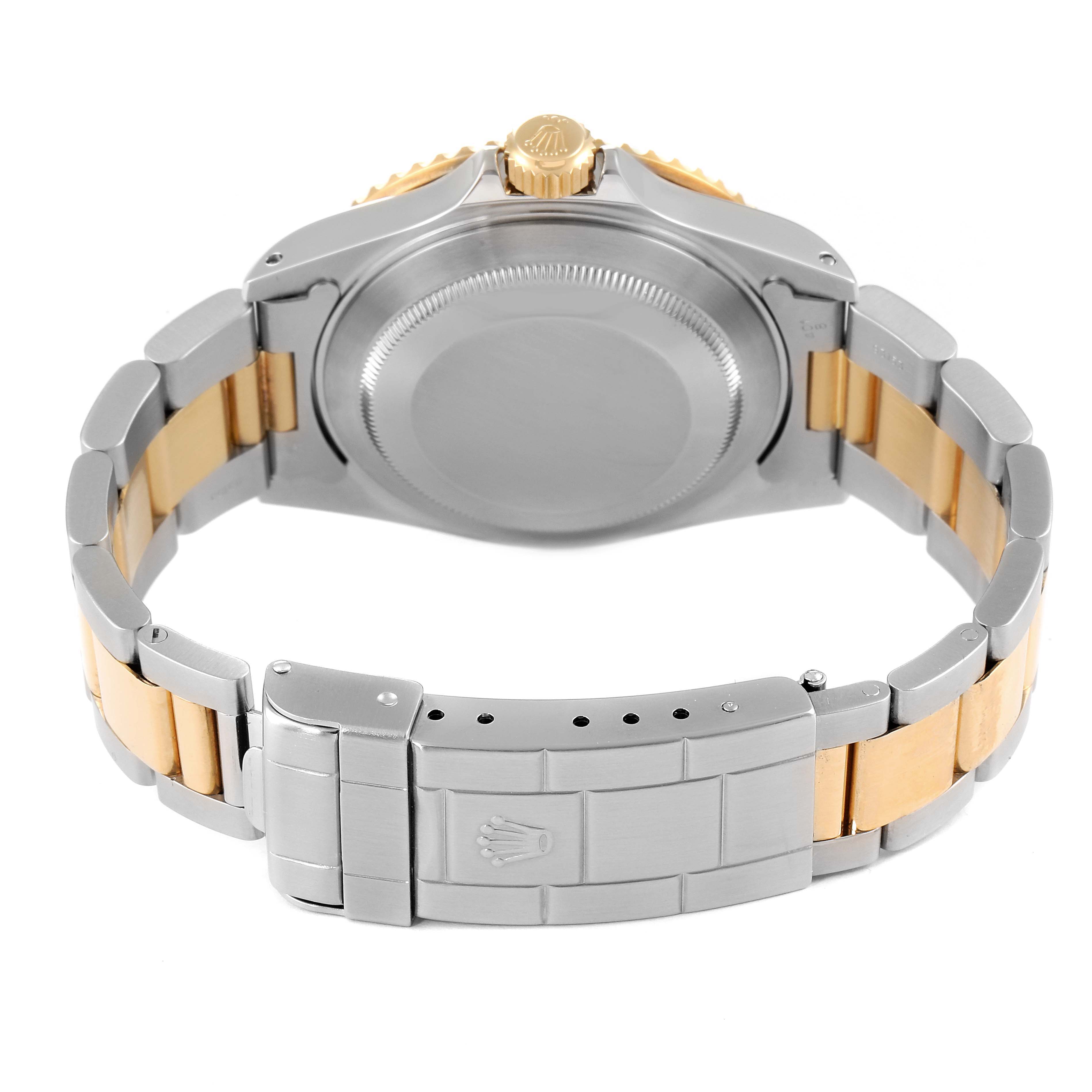 This image shows the backside and bracelet clasp of the Rolex Submariner 16613 Men's Steel and Gold (two tone) Black Dial 16613 Men's Steel and Gold (two tone) Black Dial watch.