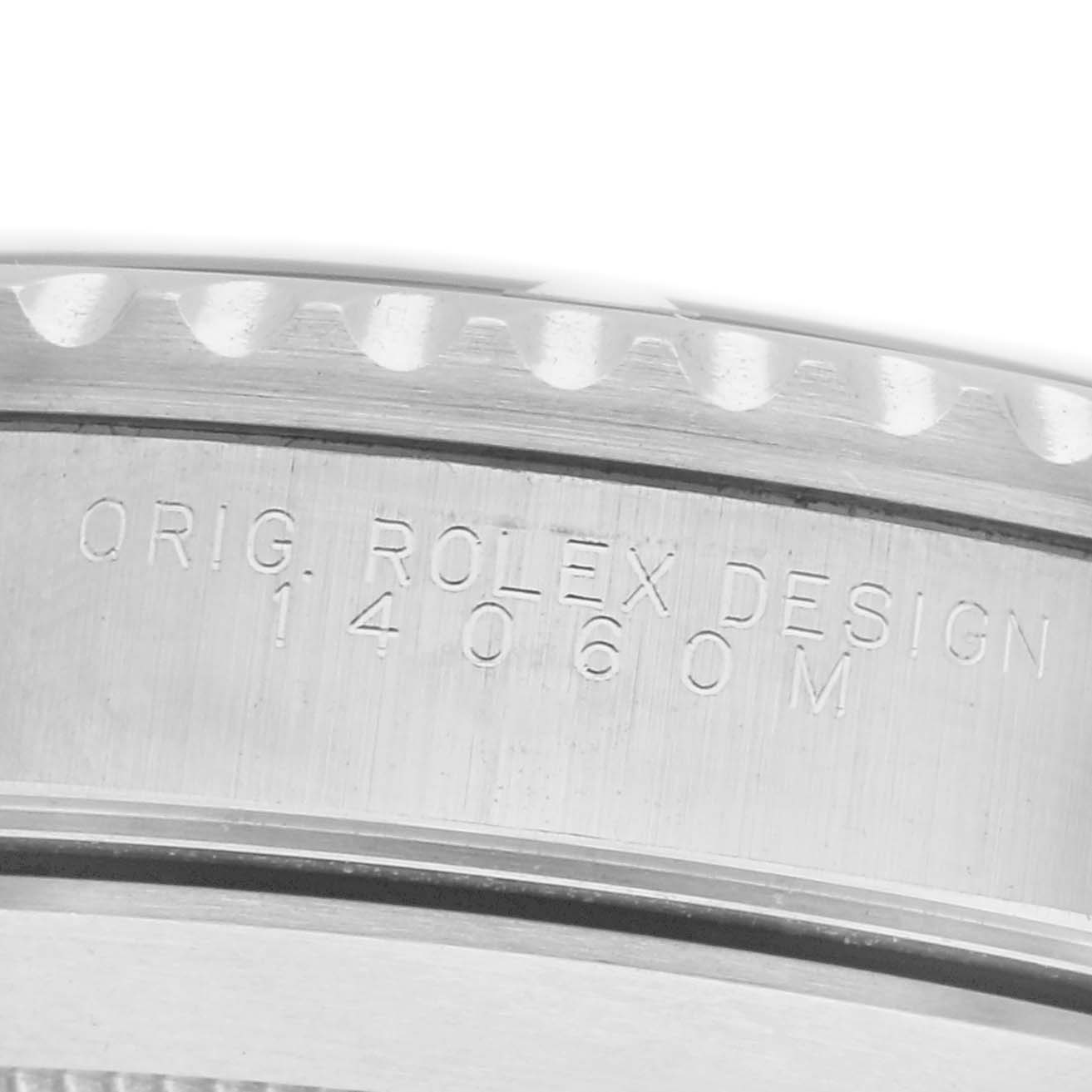 The image shows a close-up of the side engraving on the bezel of the Rolex Submariner 14060 Men
s Stainless Steel Black Dial 14060 Men
s Stainless Steel Black Dial watch, highlighting its design details.