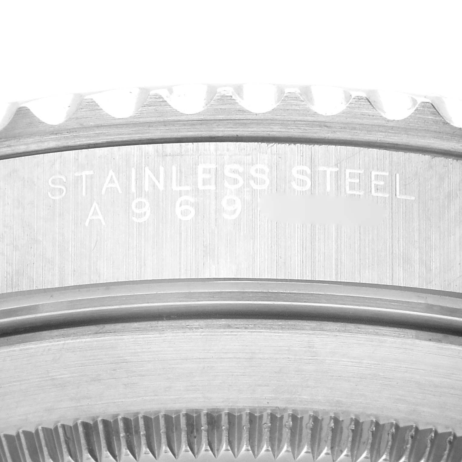 This close-up angle shows the engraved serial number and "STAINLESS STEEL" inscription on the Rolex Submariner 14060 Men
s Stainless Steel Black Dial 14060 Men
s Stainless Steel Black Dial casing.