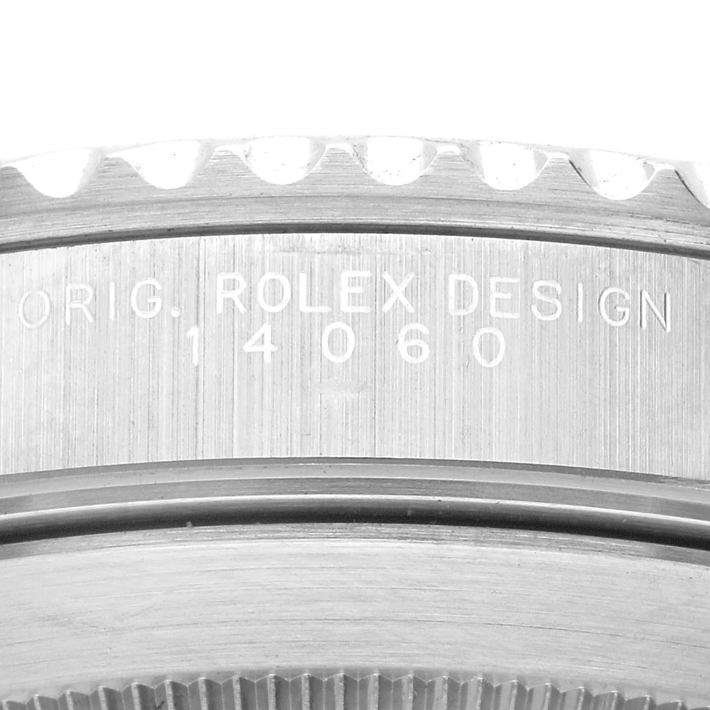This image shows a close-up of the case back and bezel of a Rolex Submariner 14060 Men
s Stainless Steel Black Dial 14060 Men
s Stainless Steel Black Dial model 14060, focusing on the engraved text and serial number.