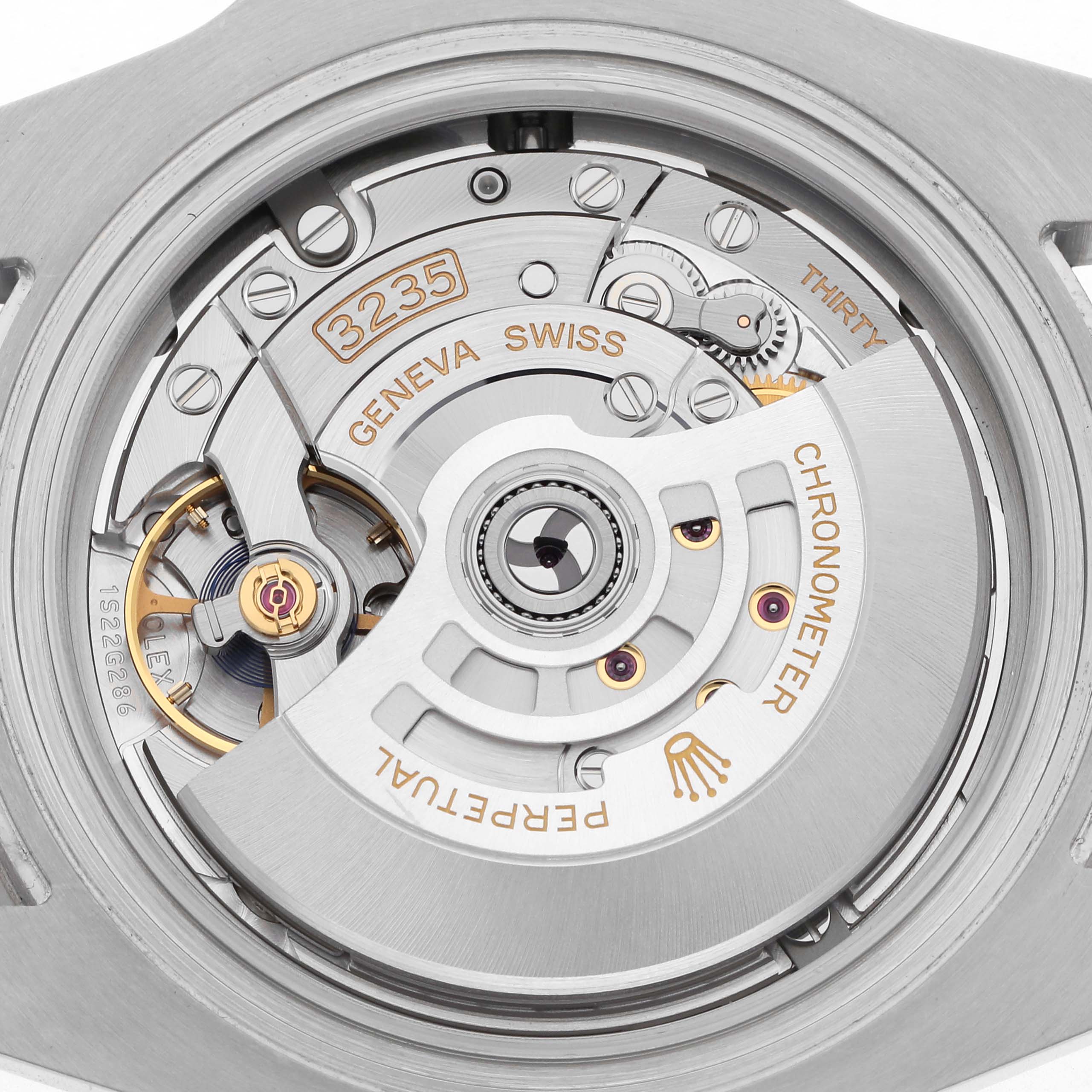 The image shows the movement of a Rolex Submariner 126610LV Men
s Stainless Steel Black Dial 126610LV Men
s Stainless Steel Black Dial watch, focusing on the intricate mechanism and components inside.