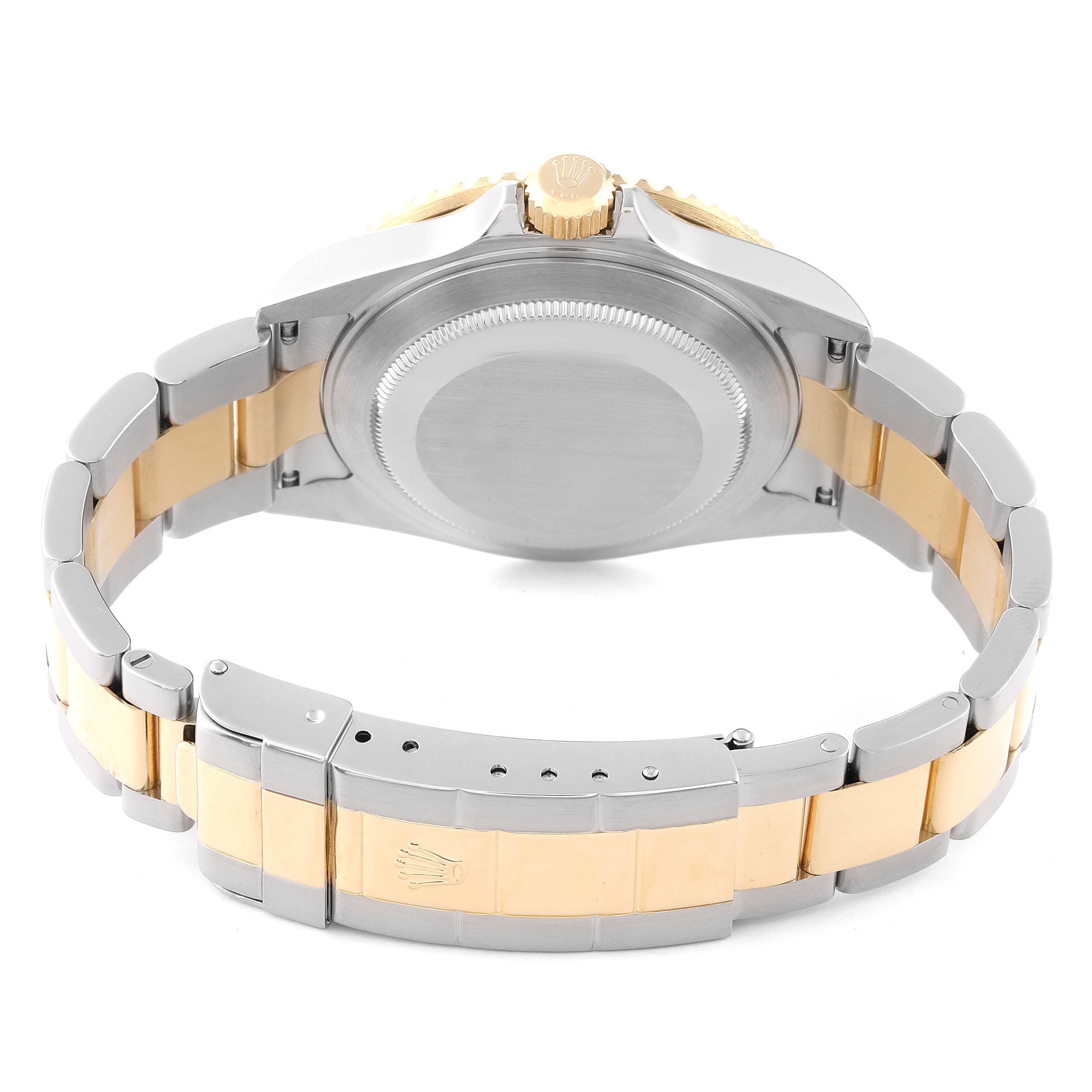 The image shows the back case and bracelet of a Rolex Submariner 16613 Men's Steel and Gold (two tone) Black Dial 16613 Men's Steel and Gold (two tone) Black Dial watch, highlighting its two-tone stainless steel and gold design.