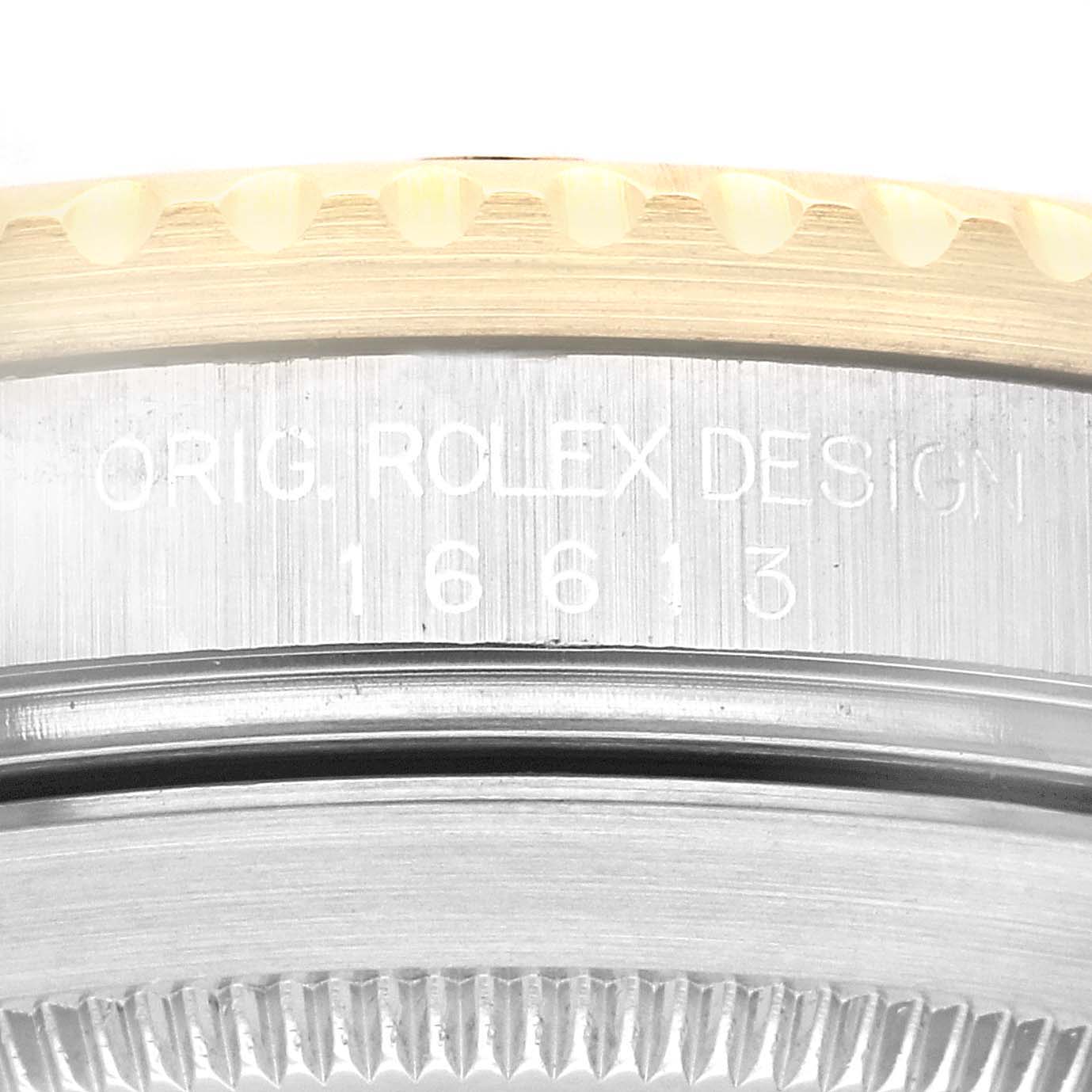 This image shows a close-up of the caseback and bezel of a Rolex Submariner 16613 Men's Steel and Gold (two tone) Black Dial 16613 Men's Steel and Gold (two tone) Black Dial watch, highlighting the model number 16613.