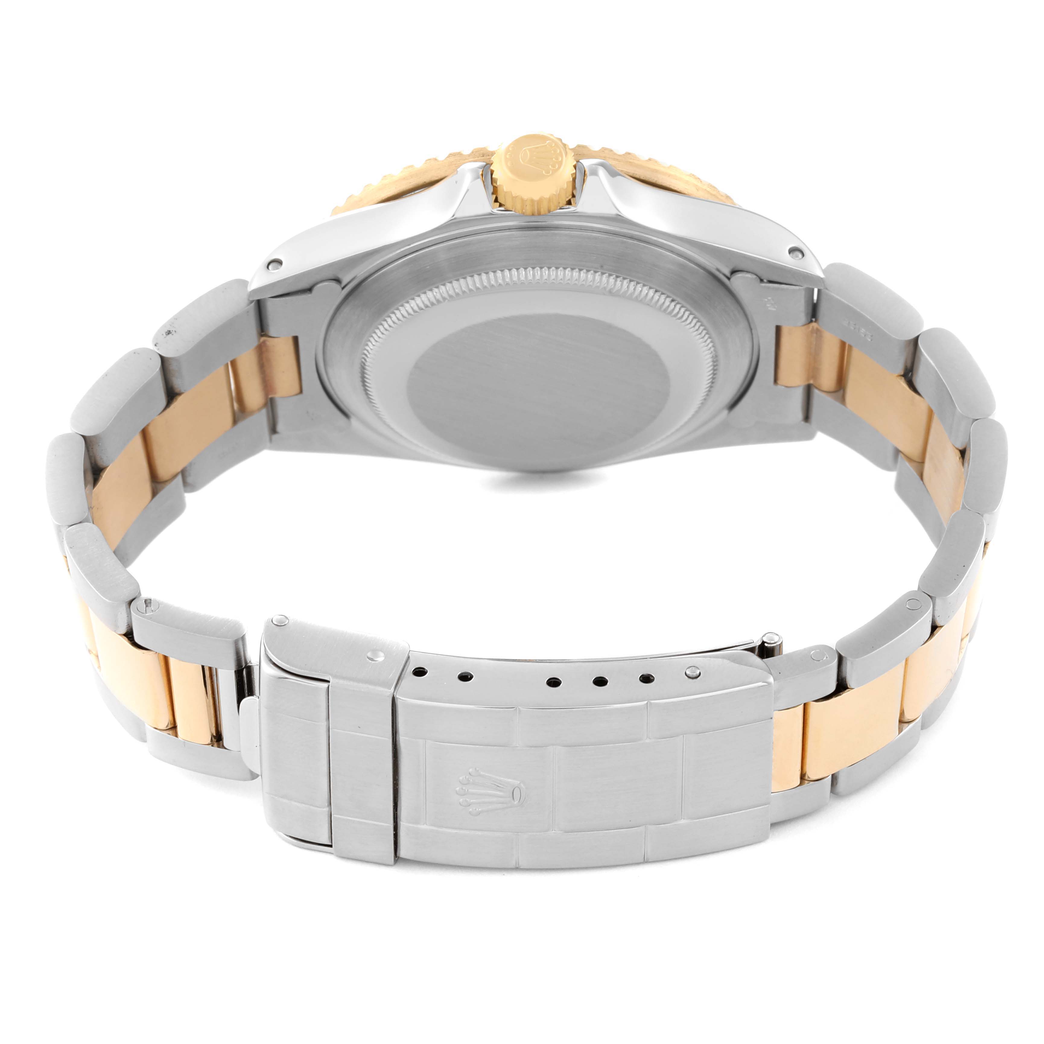 This image shows the back case, bracelet, and clasp of a Rolex Submariner 16803 Men's Steel and Gold (two tone) Black Dial 16803 Men's Steel and Gold (two tone) Black Dial watch at a rear angle.