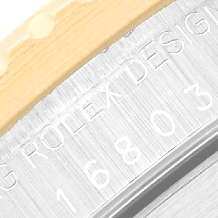 The image shows a close-up of the bezel and side of the case of a Rolex Submariner 16803 Men's Steel and Gold (two tone) Black Dial 16803 Men's Steel and Gold (two tone) Black Dial model.