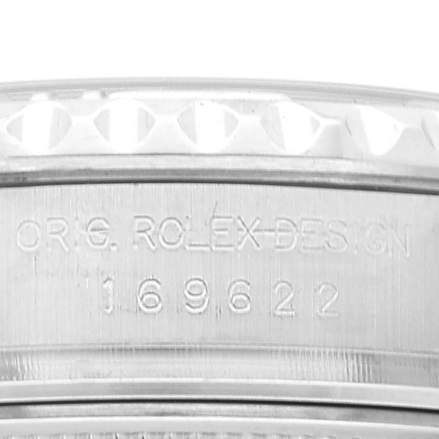 Close-up view of the side of a Rolex Yacht-Master 169622 Women
s Stainless Steel Silver Dial 169622 Women
s Stainless Steel Silver Dial watch showing the model number and part of the bezel.