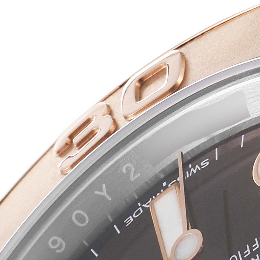 The image shows a close-up of the bezel and part of the dial of a Rolex Yacht-Master 116621 Men's Steel and Gold (two tone) Brown Dial 116621 Men's Steel and Gold (two tone) Brown Dial watch.