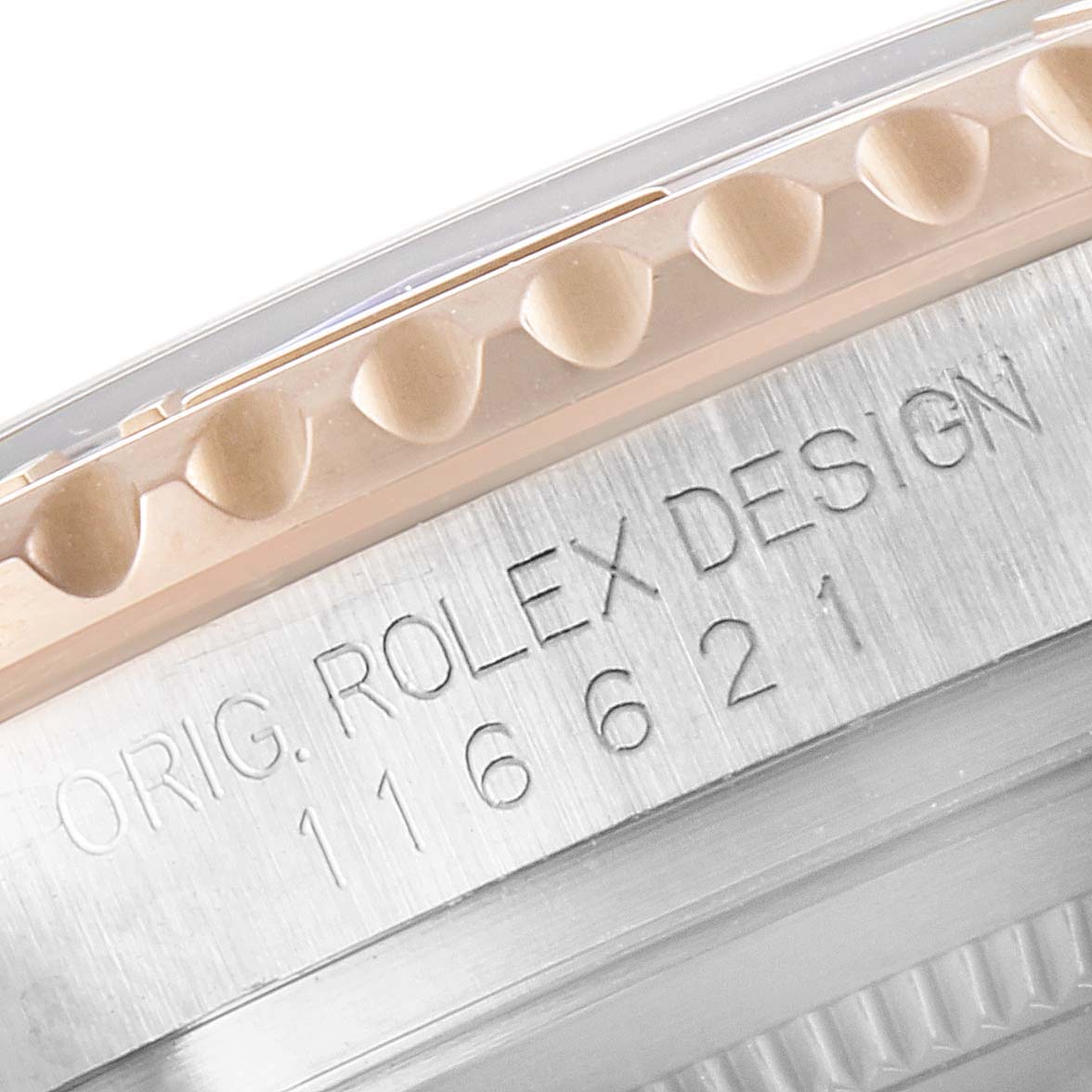 This close-up image shows the engraved case with partial bezel of a Rolex Yacht-Master 116621 Men's Steel and Gold (two tone) Brown Dial 116621 Men's Steel and Gold (two tone) Brown Dial watch, displaying its model number.