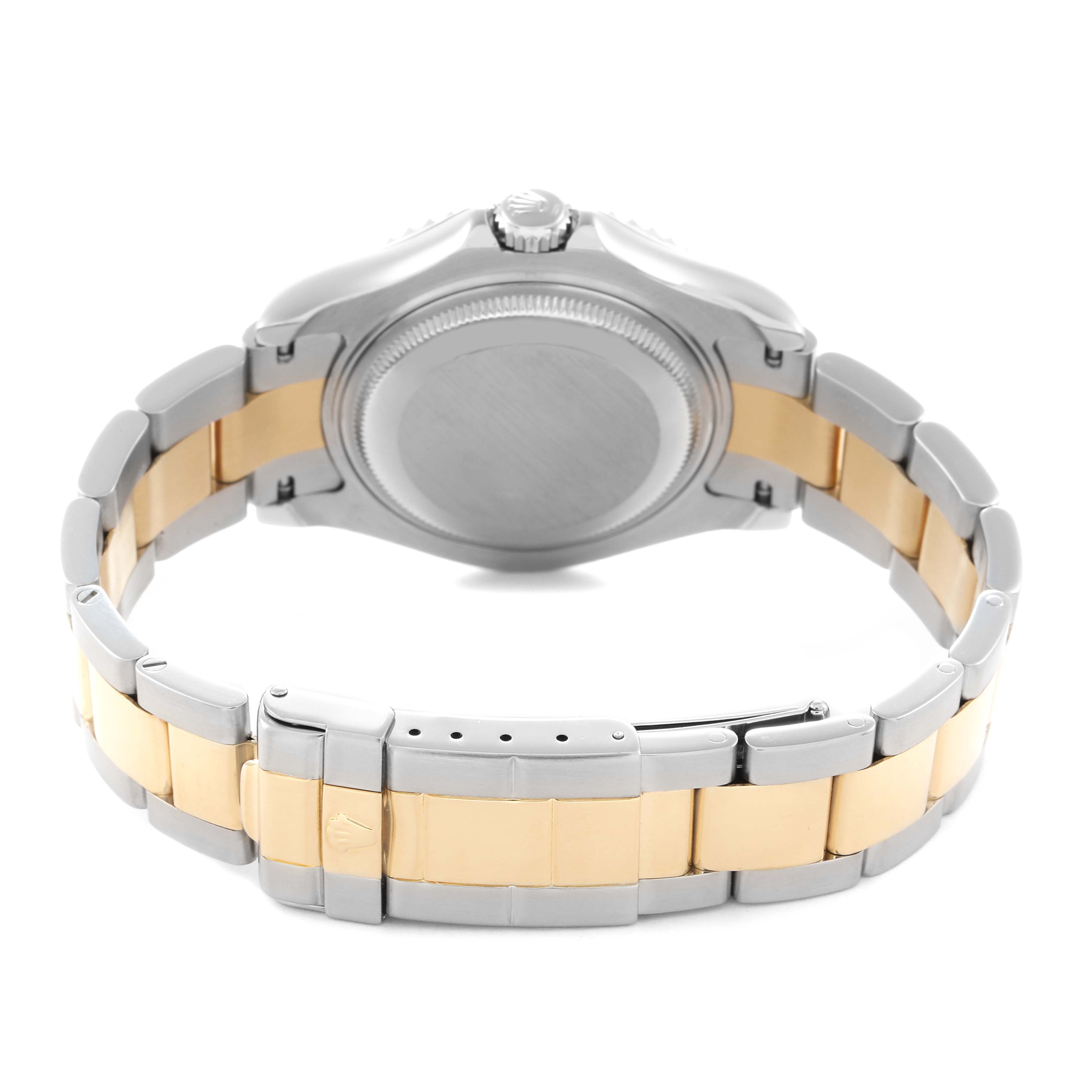 The image shows the back view of a Rolex Yacht-Master 168623 Men
s Steel and Gold (two tone) Grey Dial 168623 Men
s Steel and Gold (two tone) Grey Dial watch, highlighting the case back, crown, and two-tone bracelet.
