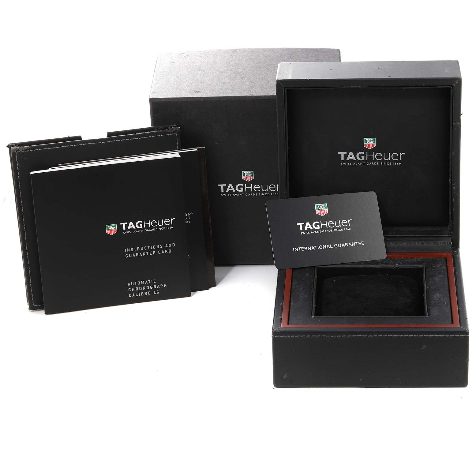 The image shows the packaging, instruction manuals, and the empty watch box for a Carrera model by Tag Heuer.