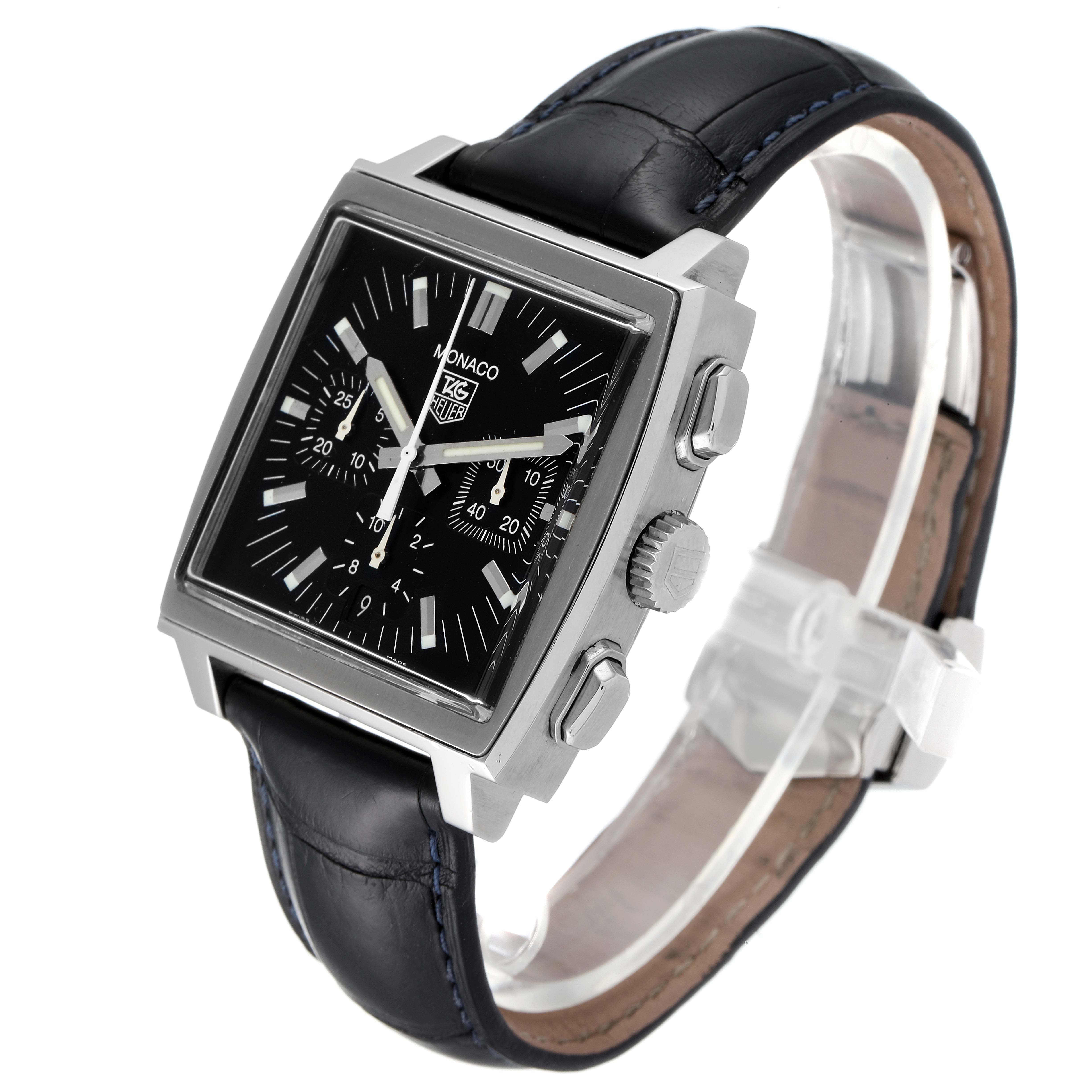 The image shows a Tag Heuer Monaco CW2111 Men's Stainless Steel Black Dial CW2111 Men's Stainless Steel Black Dial watch at a three-quarter angle, highlighting its square face, crown, pushers, and leather strap.