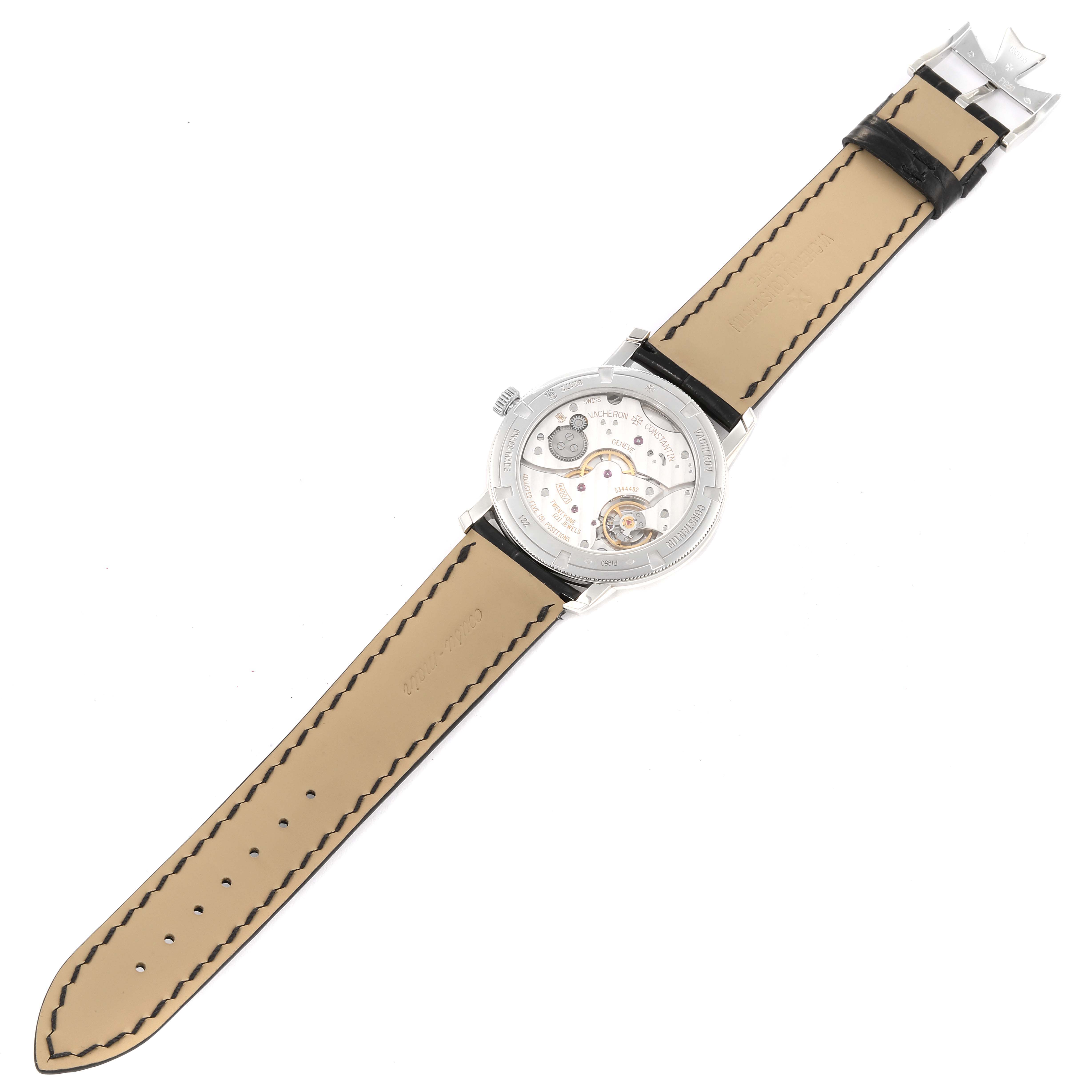 The image shows the back view of a Vacheron Constantin Traditionnelle 82172/000P-9811 Men's Platinum Grey Dial 82172/000P-9811 Men's Platinum Grey Dial watch, highlighting its open case back and tan leather strap.