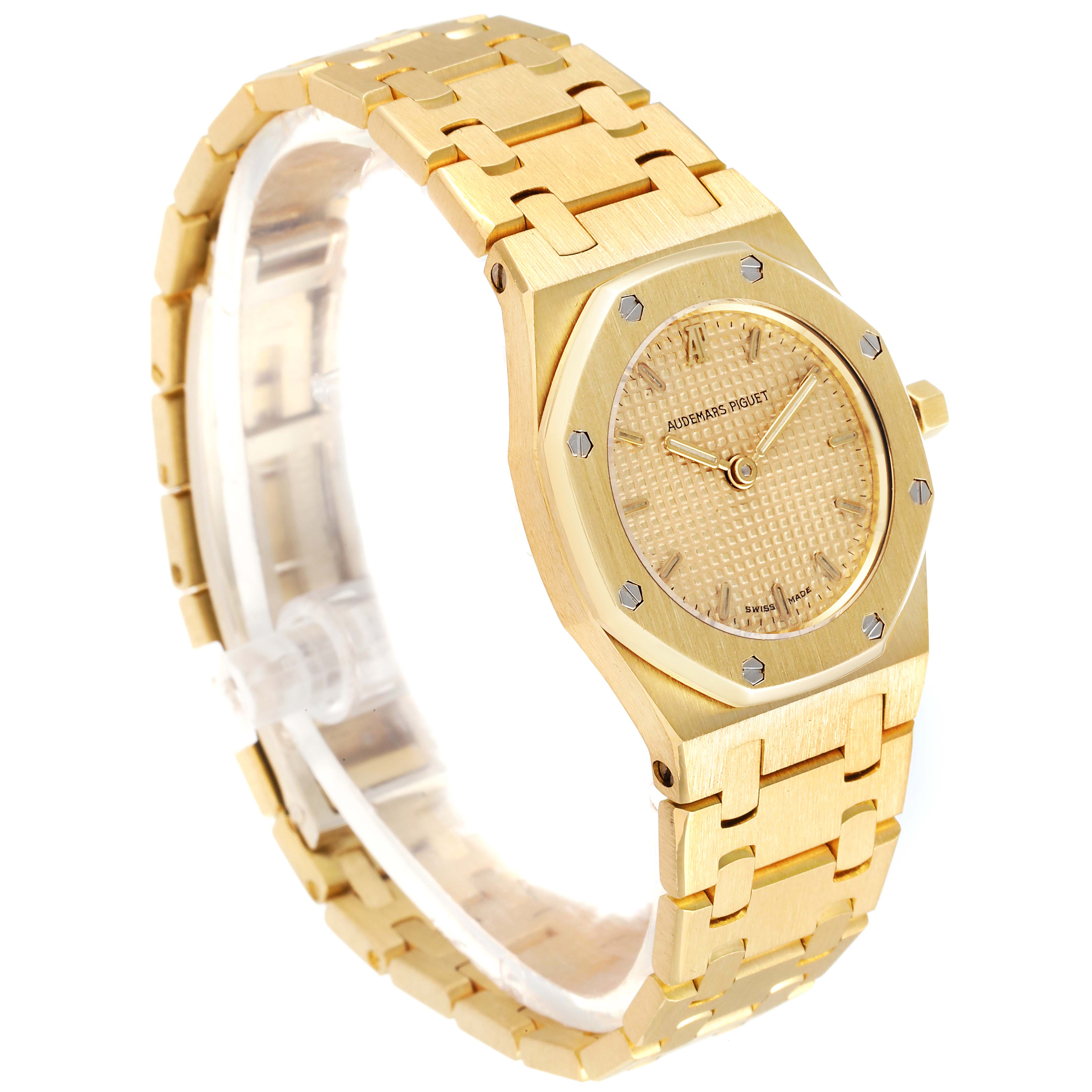 The image shows a gold Audemars Piguet Royal Oak D6519 Women's Yellow Gold Champagne Dial D6519 Women's Yellow Gold Champagne Dial watch angled from the front-left, displaying the face, bezel, and part of the bracelet.