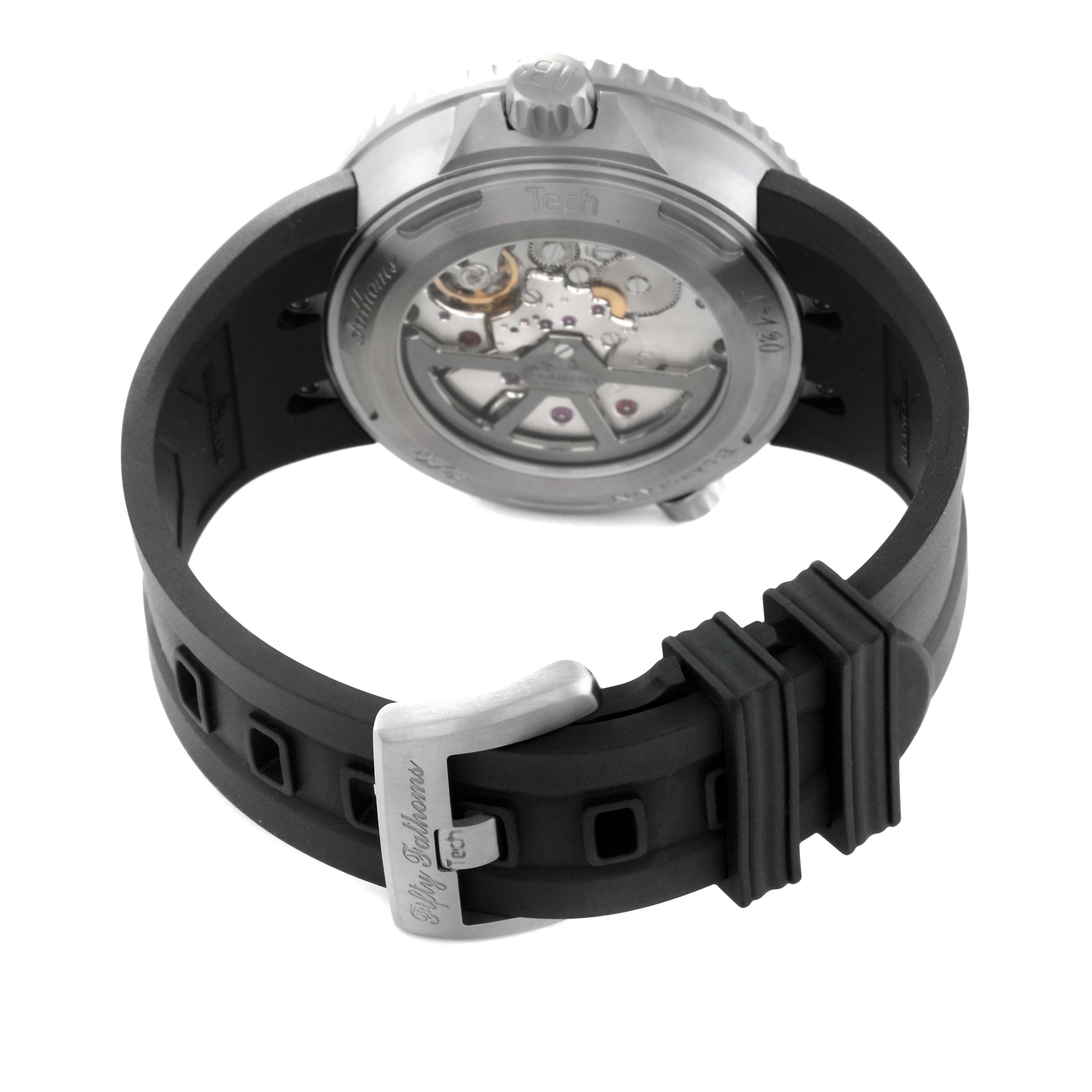 This image shows a rear view of the Fifty Fathoms model by Blancpain, highlighting its transparent case back and rubber strap.
