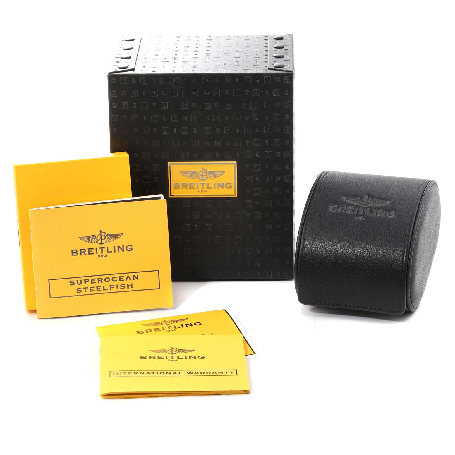 The image shows a Breitling Superocean A17390 Men's Stainless Steel Black Dial A17390 Men's Stainless Steel Black Dial model packaging, including a black box, a black watch pouch, and yellow instruction manuals.