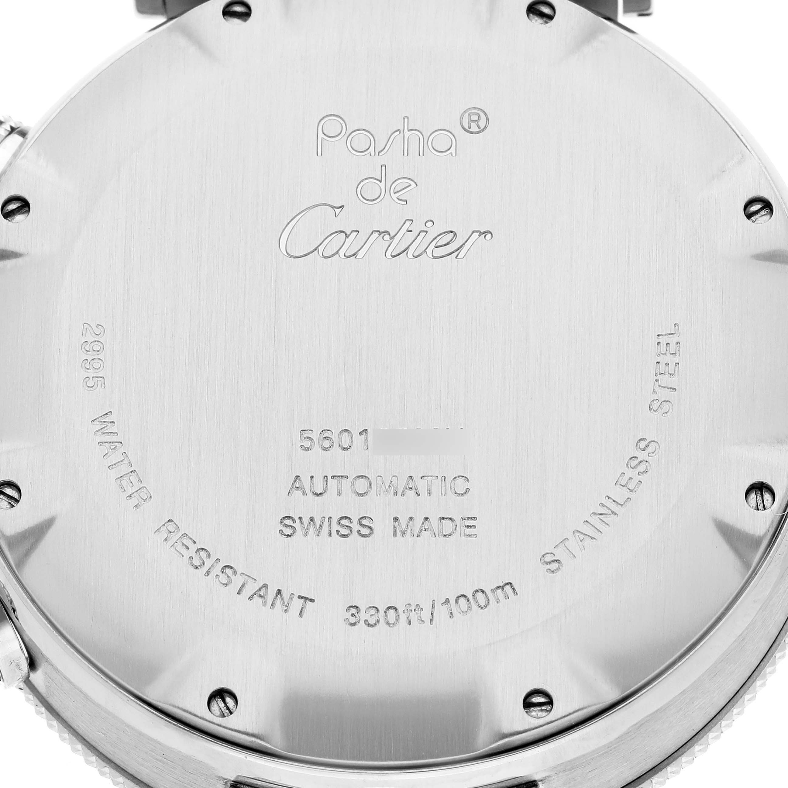 The image shows the back case of a Pasha de Cartier watch, highlighting its engravings and screw-down case back.