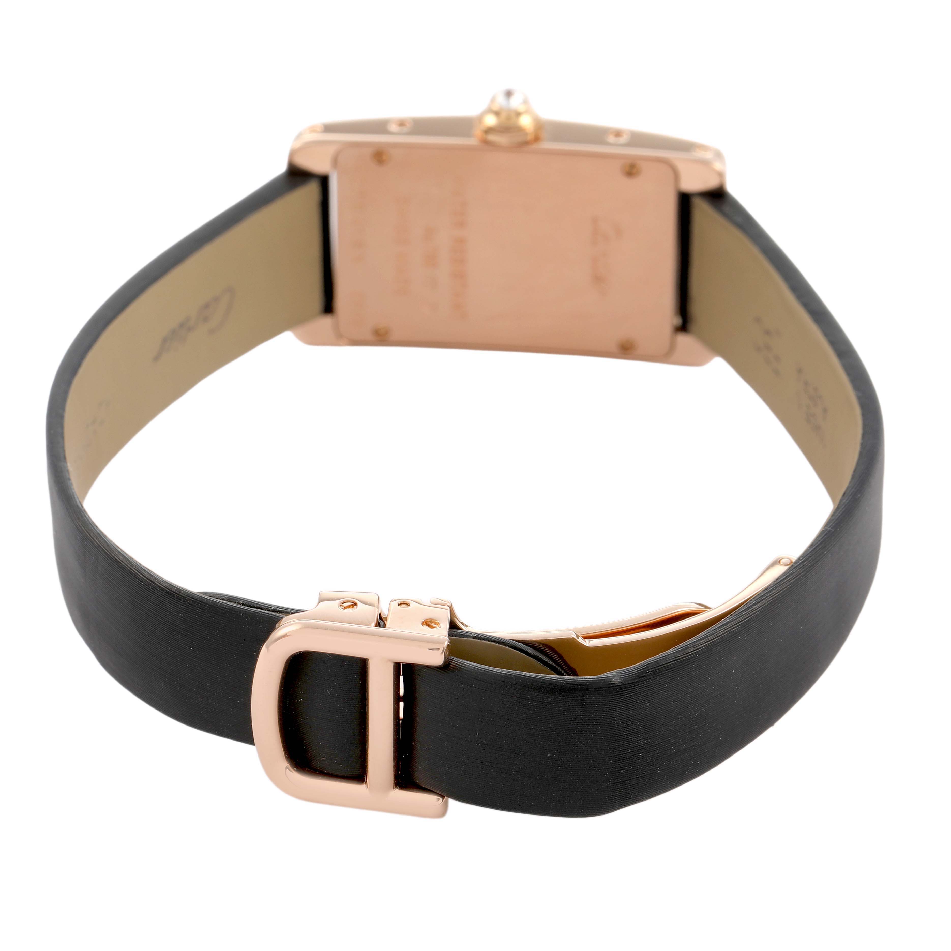 The image shows a rear view of the Cartier Tank Americaine WJTA0002 Women's Rose Gold Silver Dial watch, highlighting the strap and clasp.