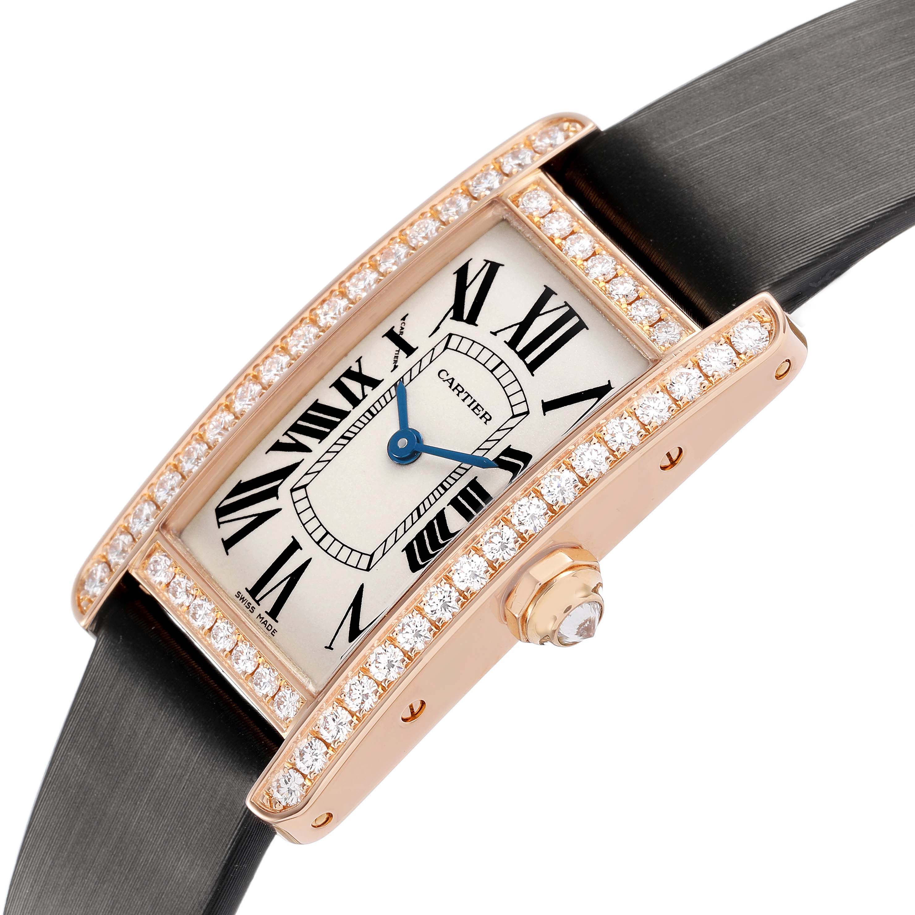 The Cartier Tank Americaine WJTA0002 Women's Rose Gold Silver Dial watch is shown at an angled side view, featuring a diamond-set bezel and a leather strap.