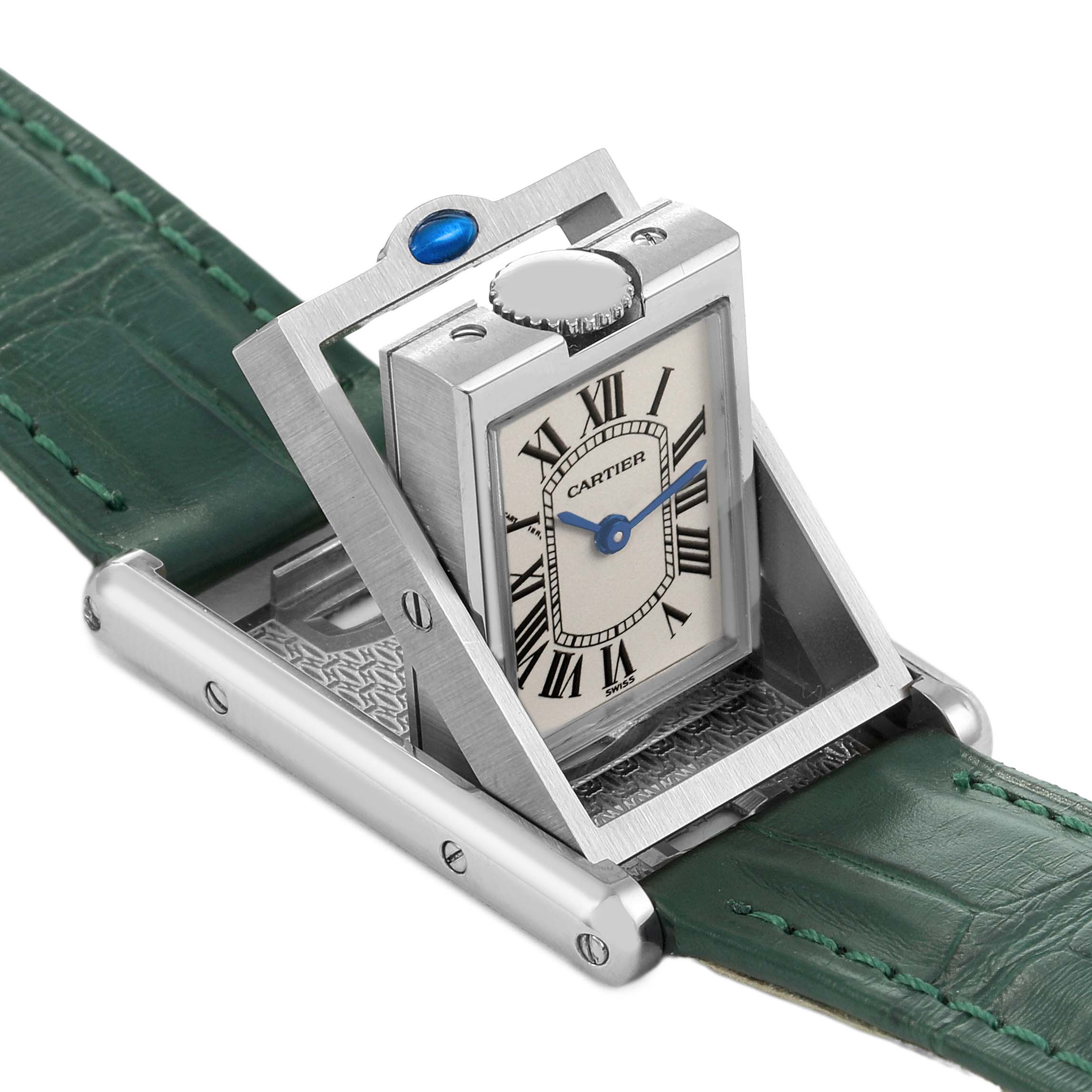 The Cartier Tank Basculante W1011158 Women's Stainless Steel Silver Dial watch is shown at an angle, highlighting its swiveling case and green leather strap.