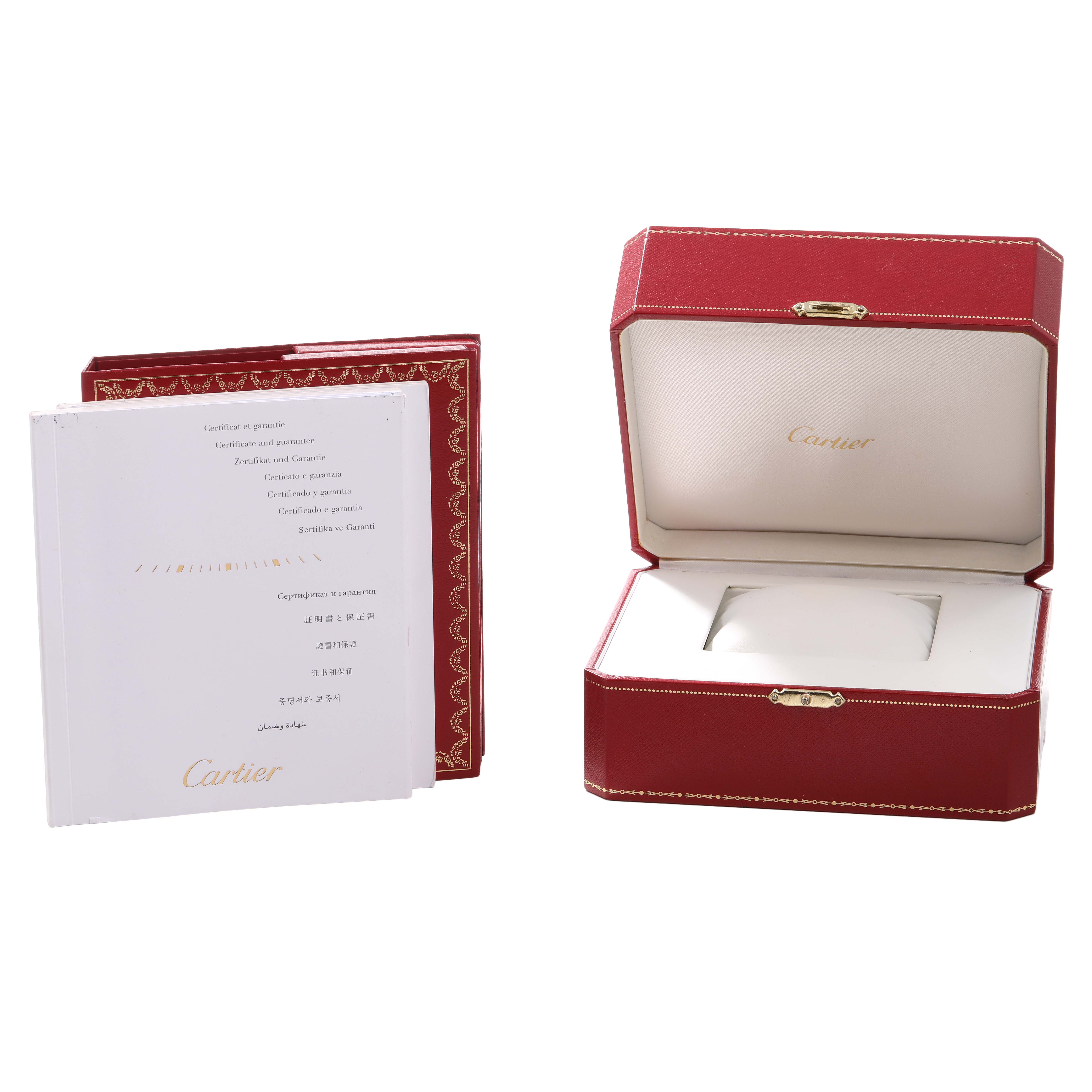 The image shows a Cartier Tank Basculante W1011158 Women's Stainless Steel Silver Dial case and booklets from a side angle, highlighting the packaging and documents.