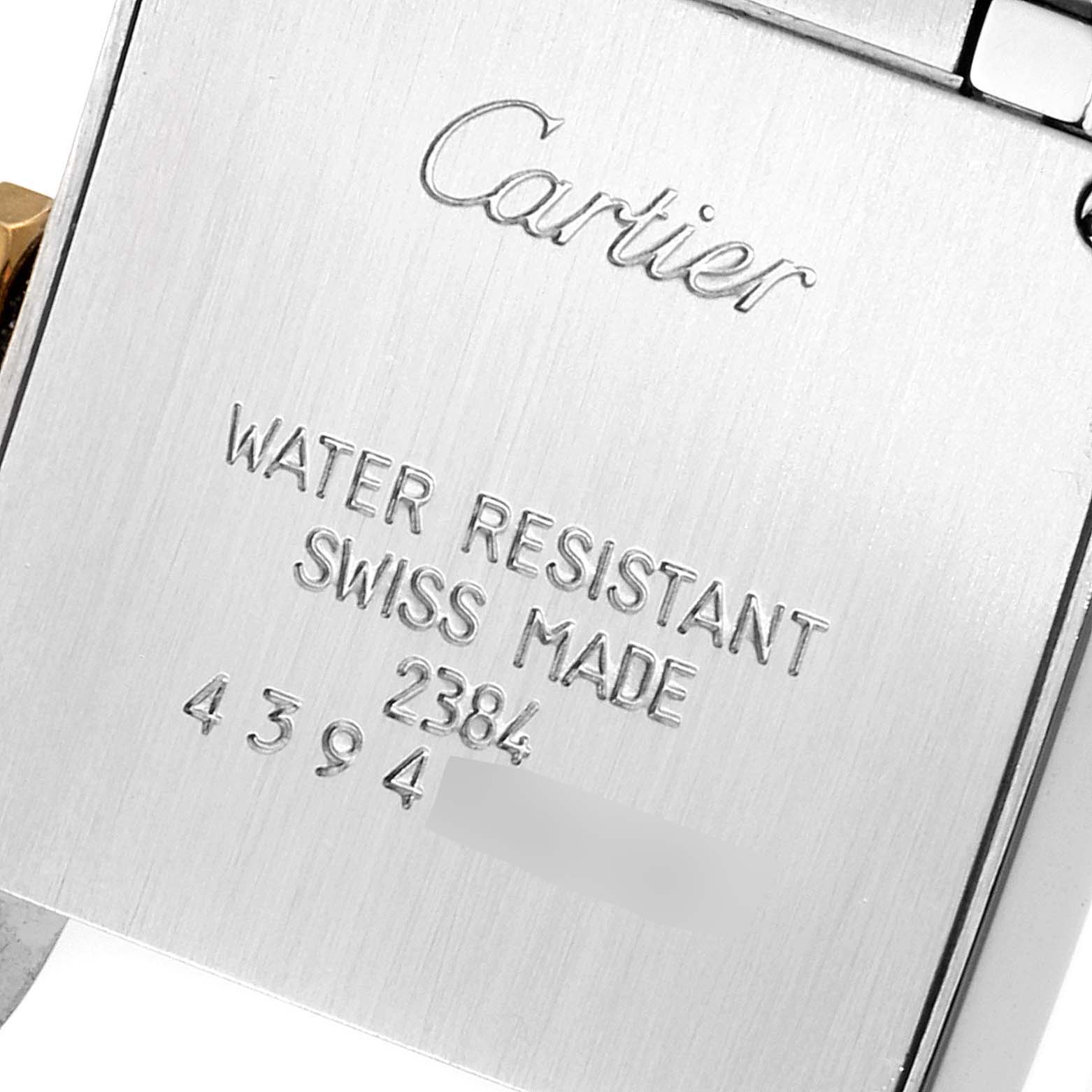 This image shows the back case of a Cartier Tank Francaise W51007Q4 Women
s Steel and Gold (two tone) Silver Dial W51007Q4 Women
s Steel and Gold (two tone) Silver Dial watch, highlighting the brand name and model details.