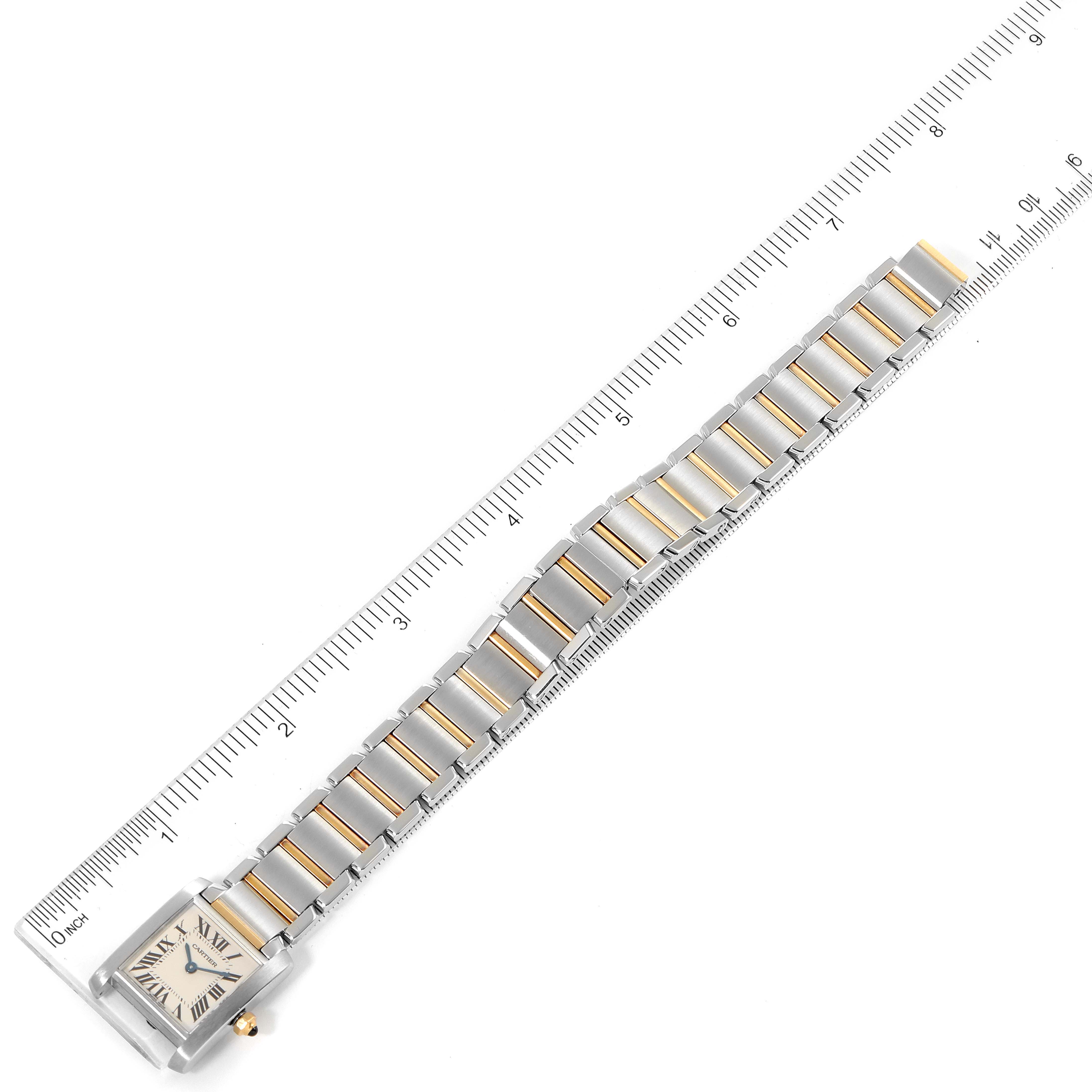 The image shows a top-down view of the Tank Francaise watch by Cartier, including its face, bracelet, and a ruler for scale.