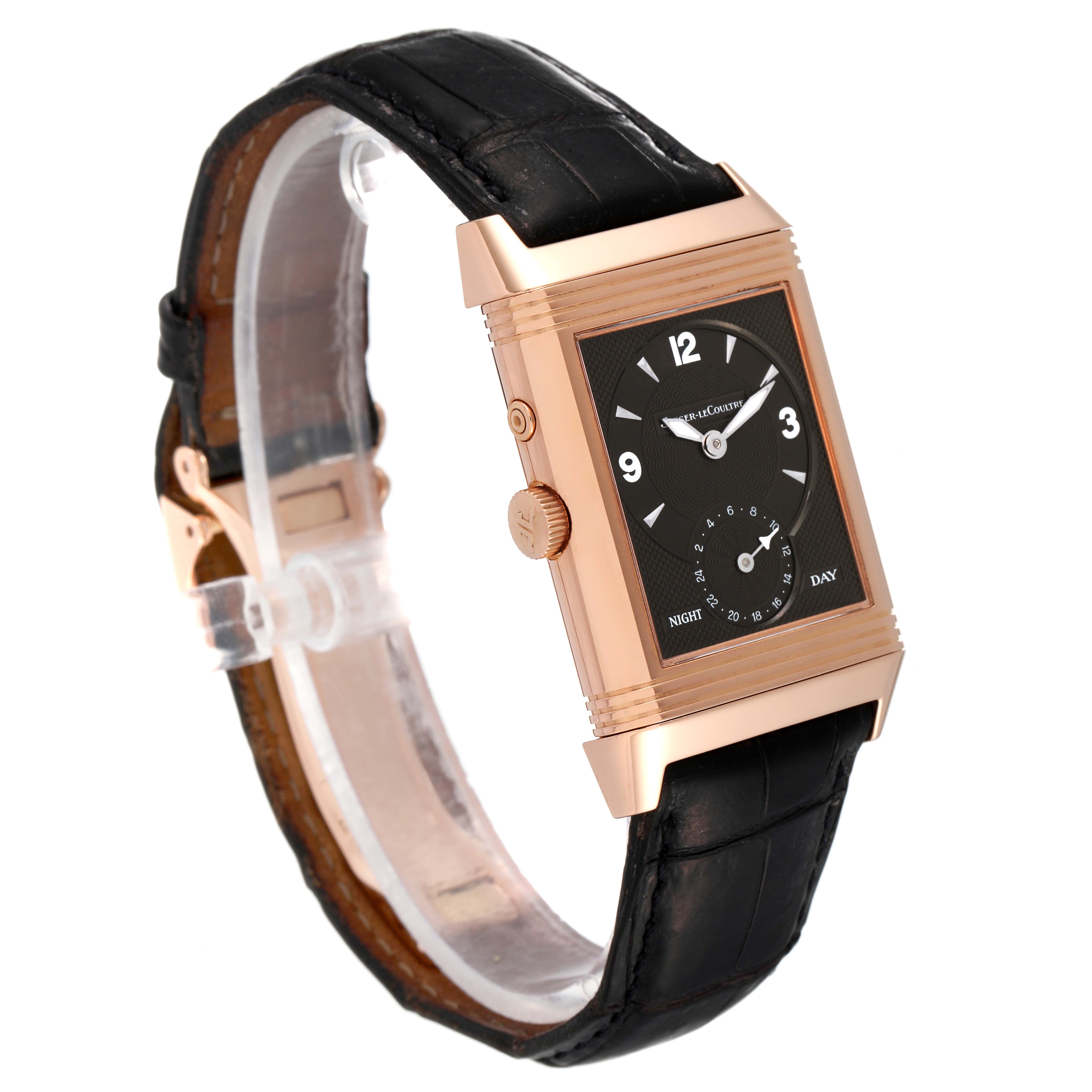 This image shows a Jaeger LeCoultre Reverso Q270254 Men
s Rose Gold Silver Dial Q270254 Men
s Rose Gold Silver Dial watch from an angled view, highlighting its rectangular dial and leather strap.