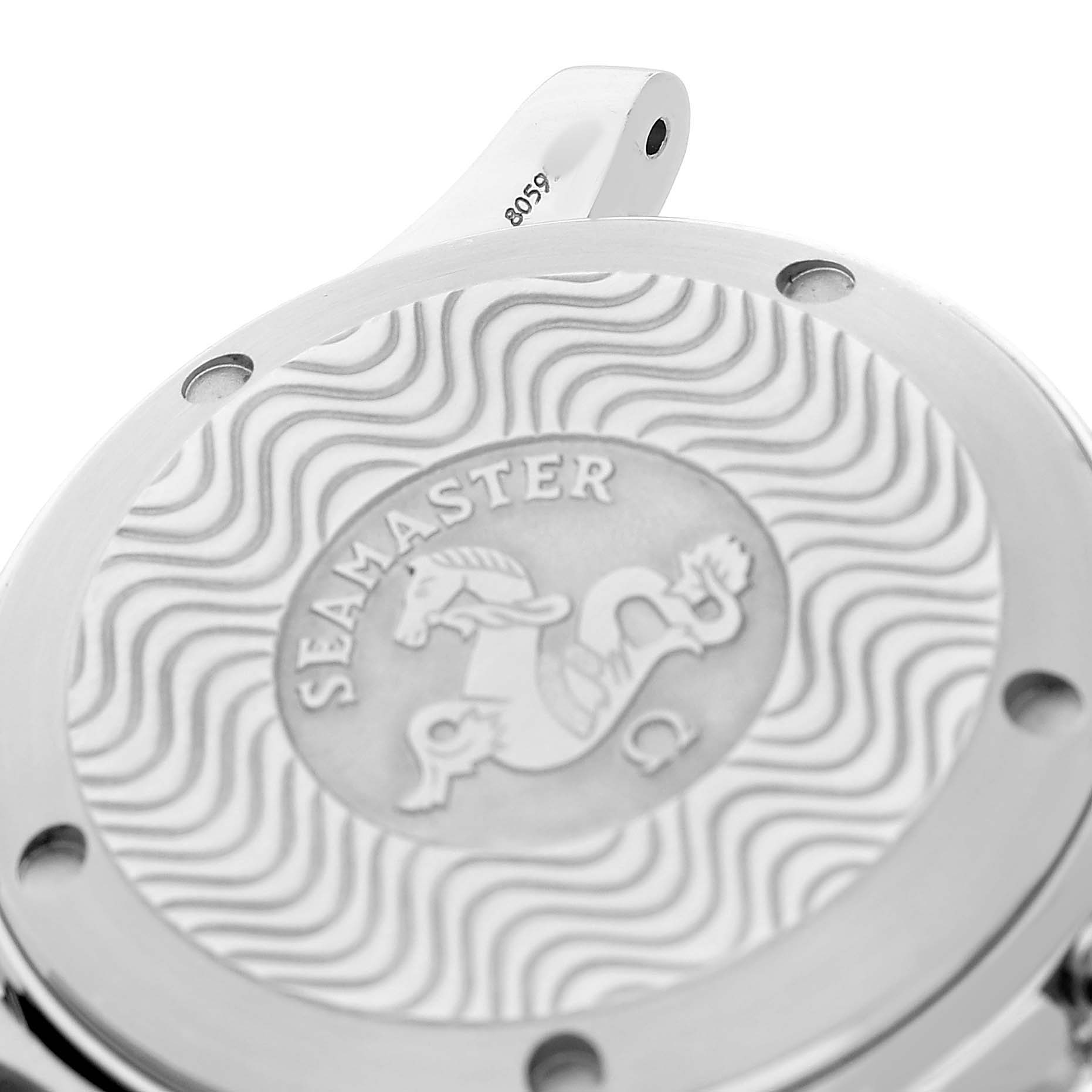The image shows the back case of an Omega Seamaster 2551.80.00 Men's Stainless Steel Blue Dial watch, displaying the engraved logo and wavy pattern.
