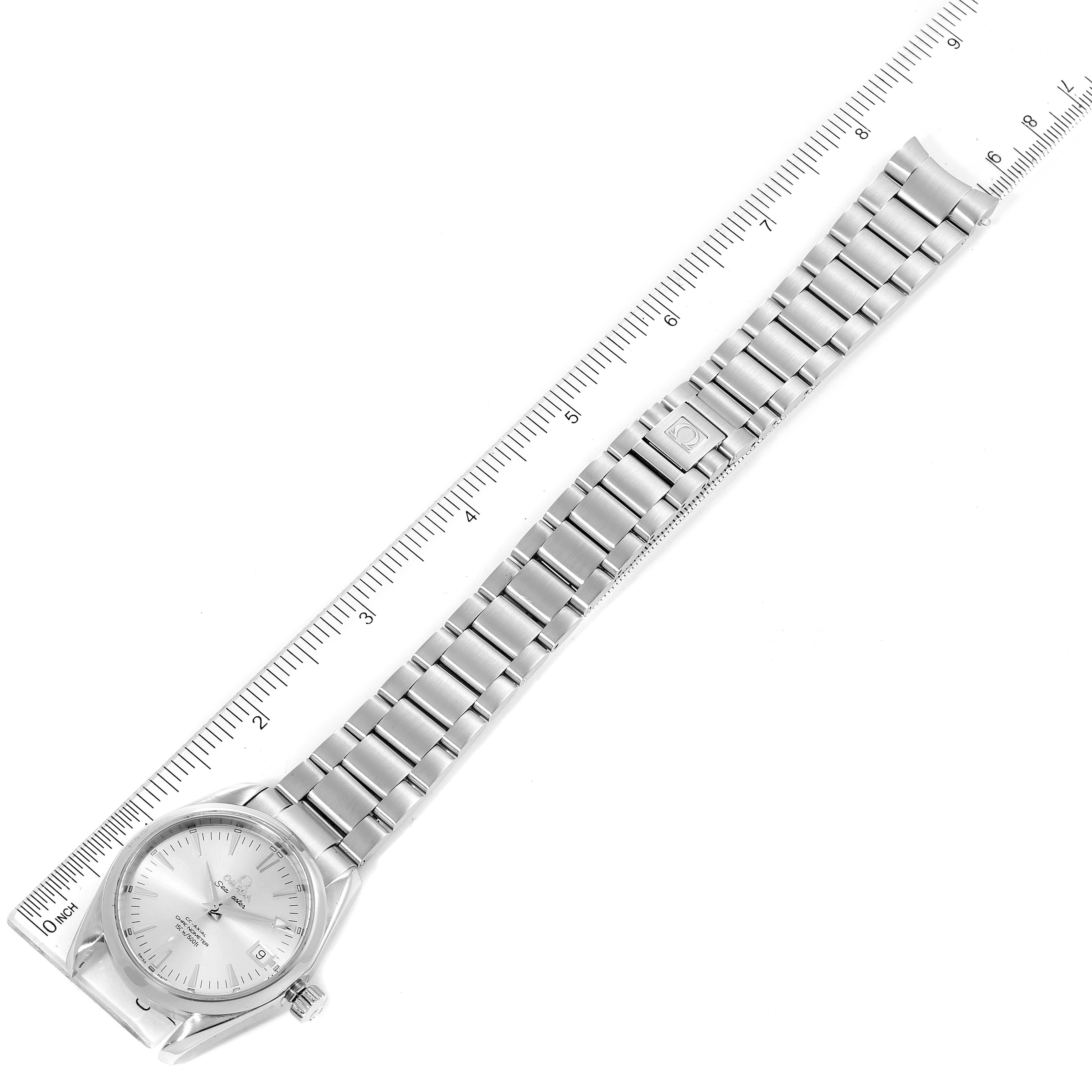 The Omega Aqua Terra 2504.30.00 Men
s Stainless Steel Silver Dial 2504.30.00 Men
s Stainless Steel Silver Dial watch is shown in a top-down view, displaying the dial and full metal bracelet against a measurement scale.