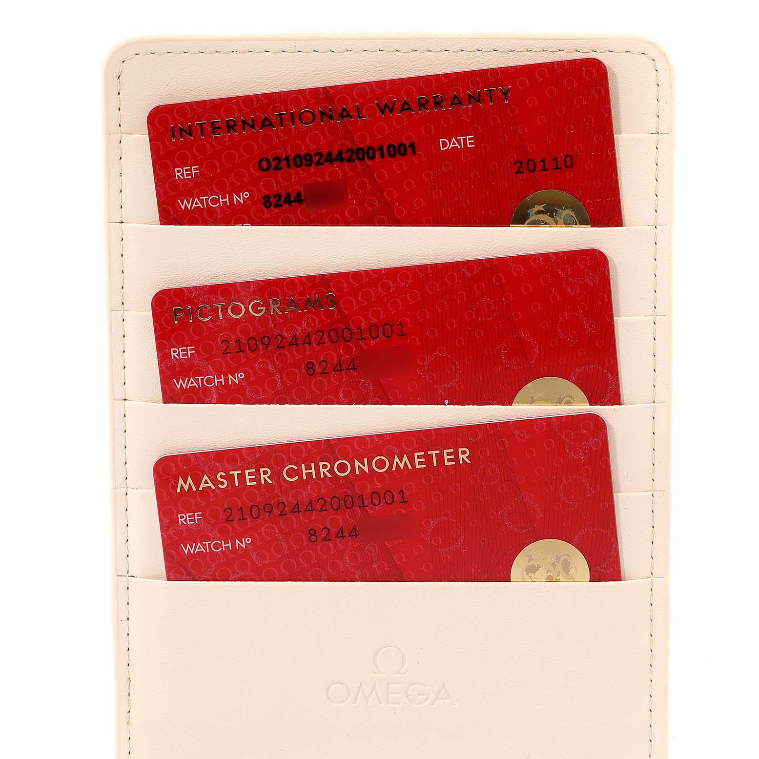 The image shows Omega Seamaster 210.92.44.20.01.001 Men's Ceramic Black Dial 210.92.44.20.01.001 Men's Ceramic Black Dial International Warranty cards and certificates in a cream-colored holder.