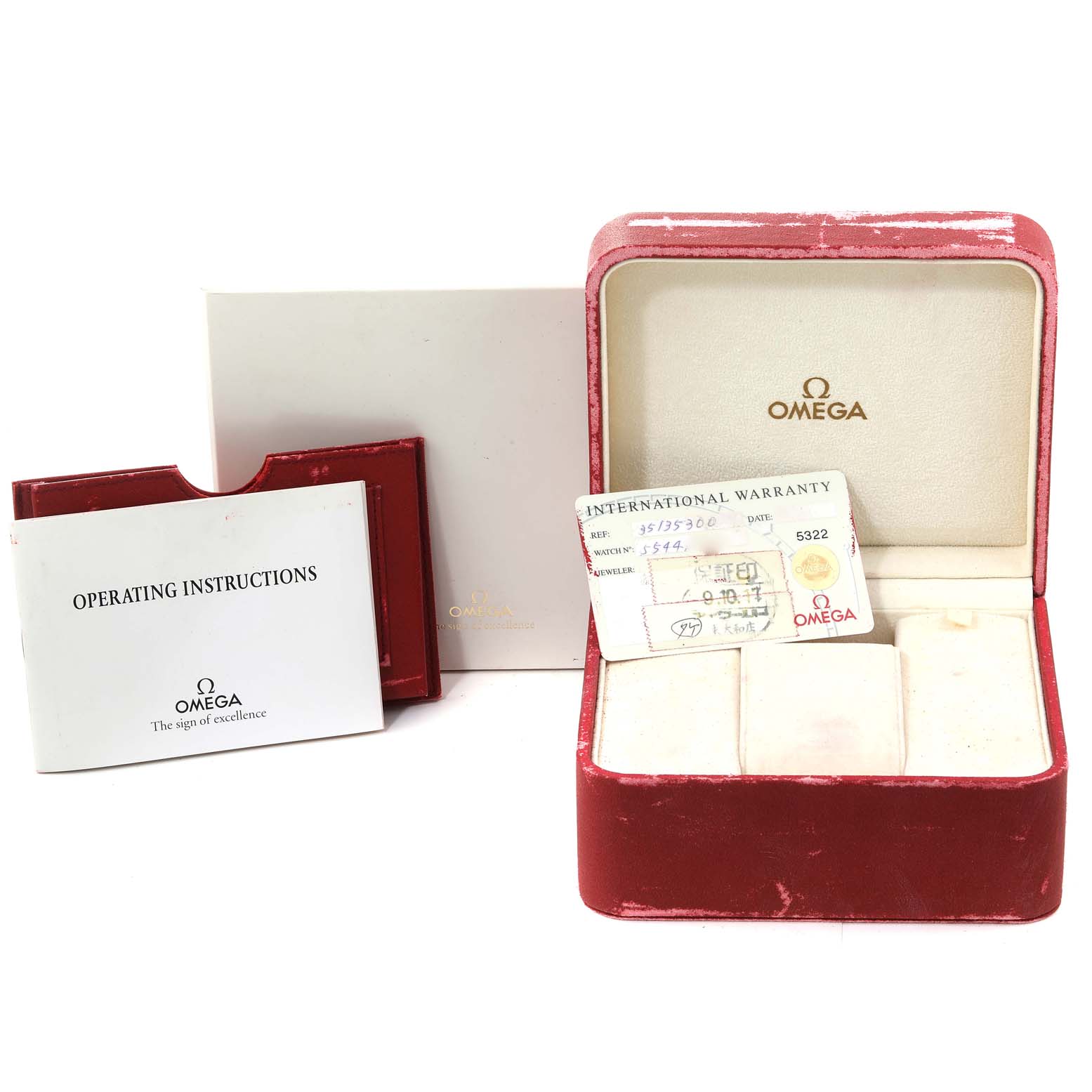 The image shows the Omega Speedmaster 3513.53.00 Men's Stainless Steel Black Dial 3513.53.00 Men's Stainless Steel Black Dial packaging, including an empty red watch box, operating instructions, and an international warranty card.