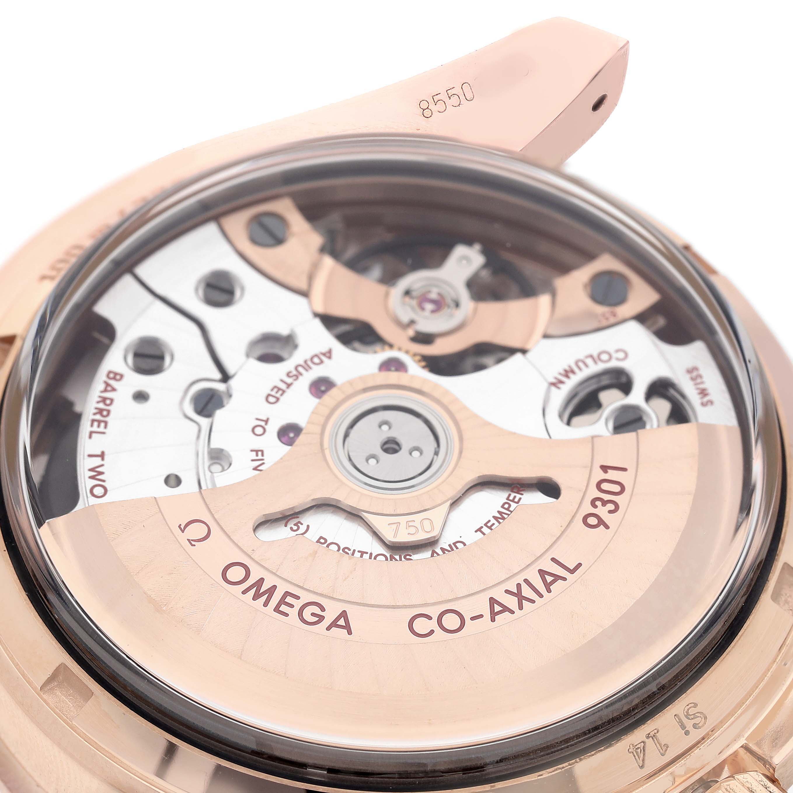 The image shows the back view of an Omega Speedmaster 311.63.44.51.01.001 Men's Rose Gold Black Dial's movement, highlighting the Co-Axial escapement and other internal mechanisms.