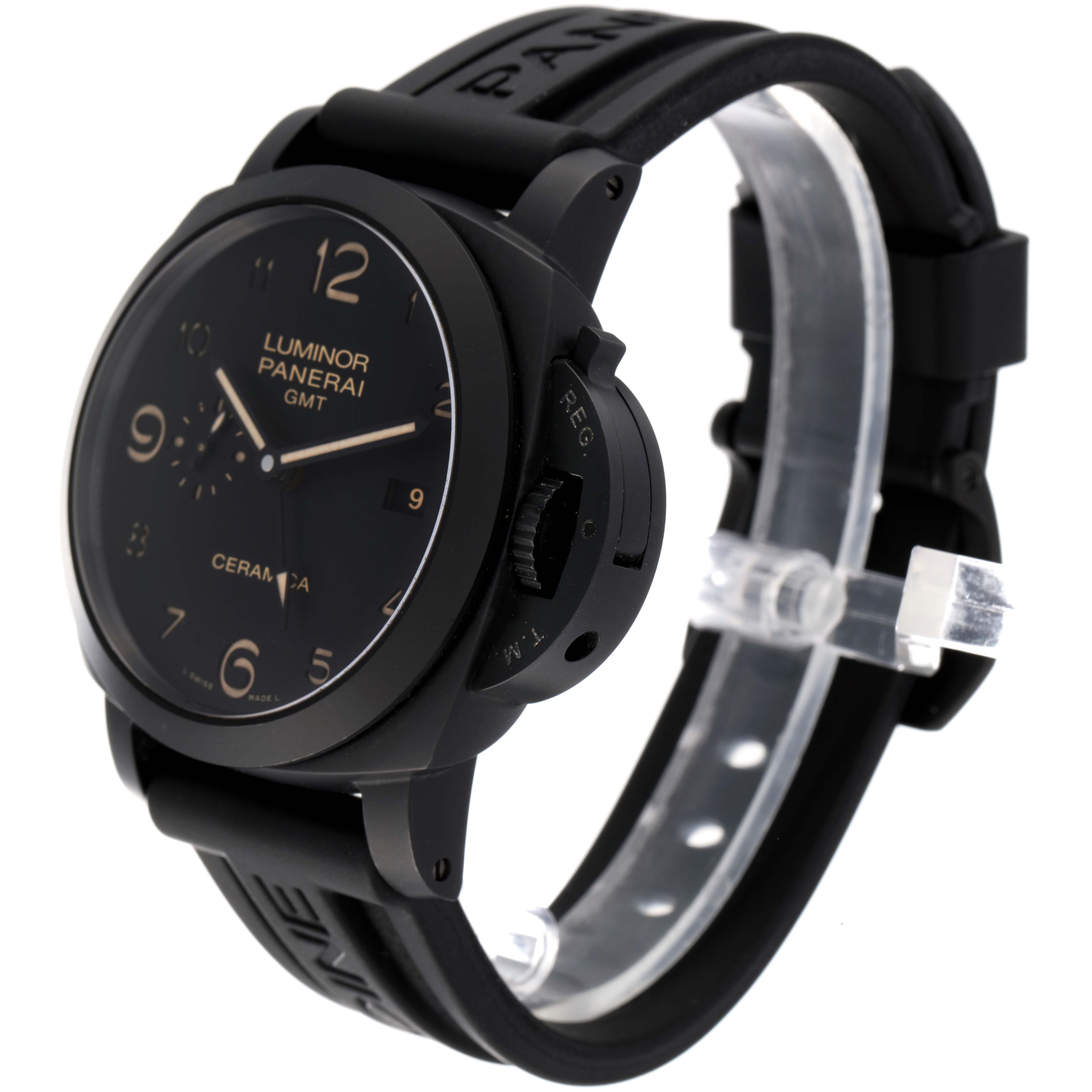 The Luminor Panerai GMT watch is shown at a slight side angle, displaying its black dial, case, and black rubber strap.