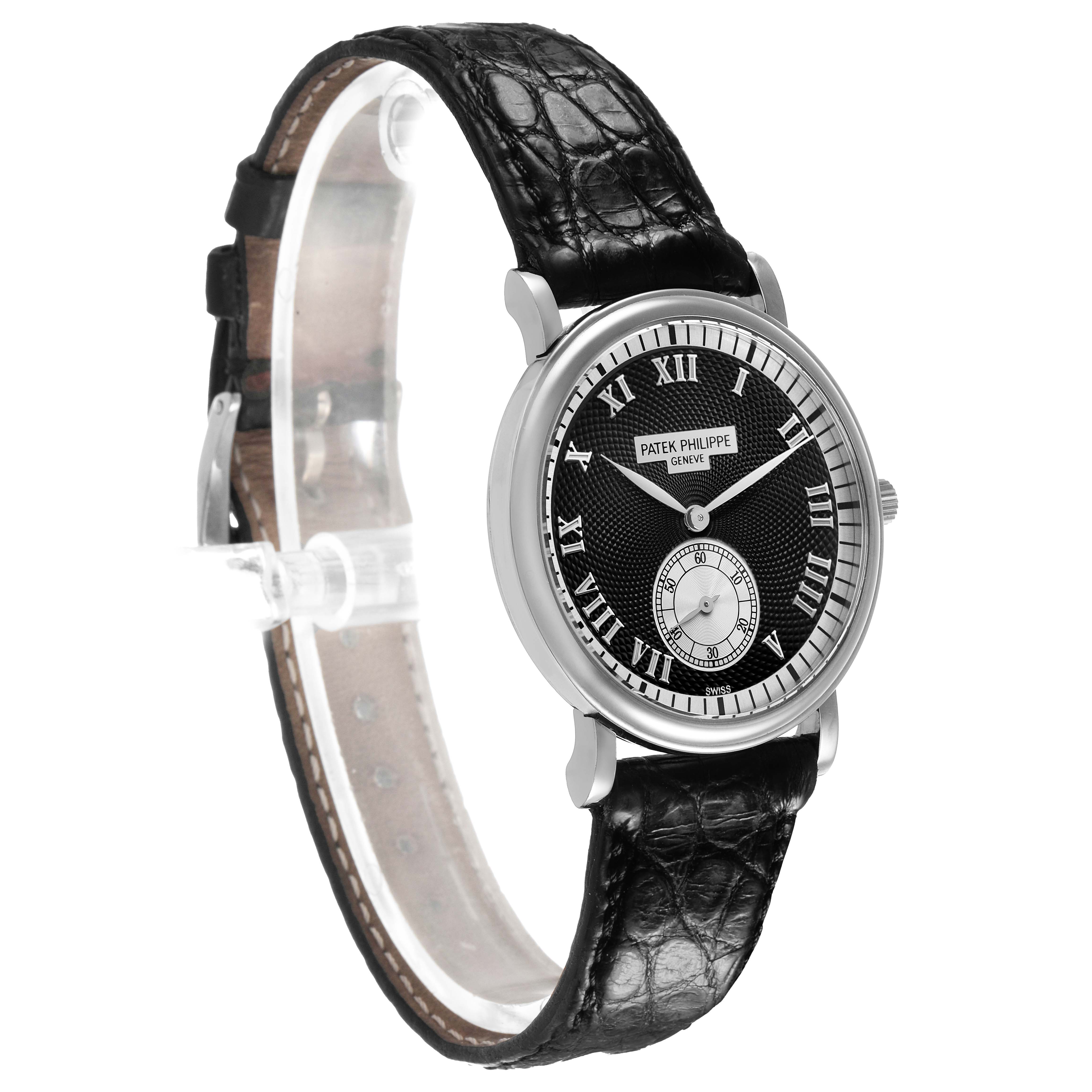 The image shows a side angle of the Patek Philippe Calatrava 5022G Men's White Gold Black Dial, highlighting the dial, Roman numerals, and black leather strap.