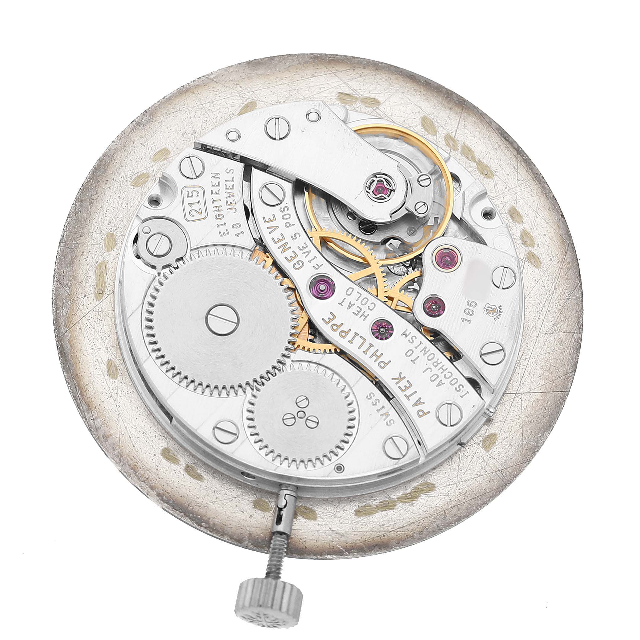 The image shows the movement of a Patek Philippe Calatrava 5022G Men's White Gold Black Dial watch from a top-down angle, revealing gears and components.