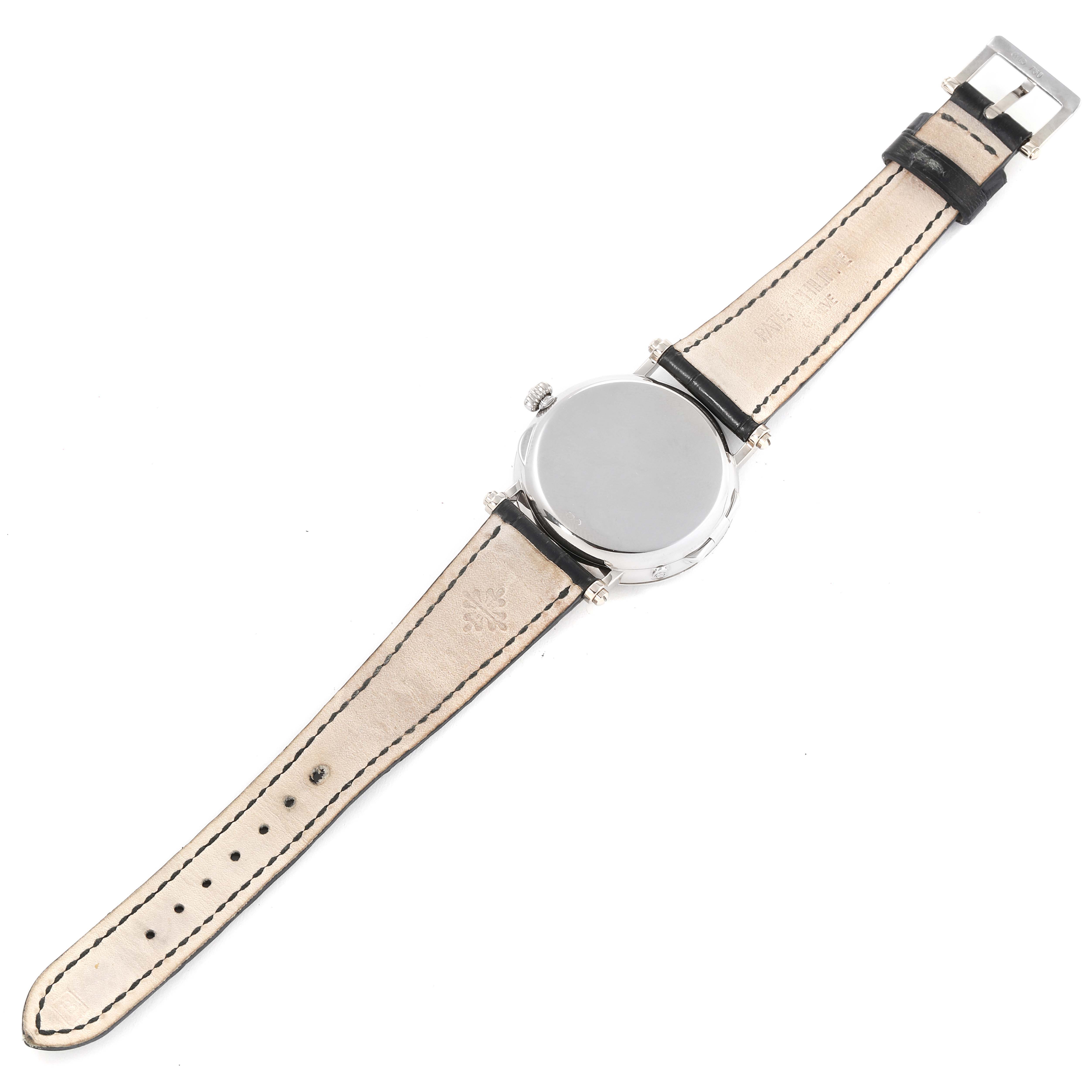 This image shows the back view of the Patek Philippe Complications 5015G-001 Men's White Gold White Dial 5015G-001 Men's White Gold White Dial model watch with its leather strap and clasp visible.