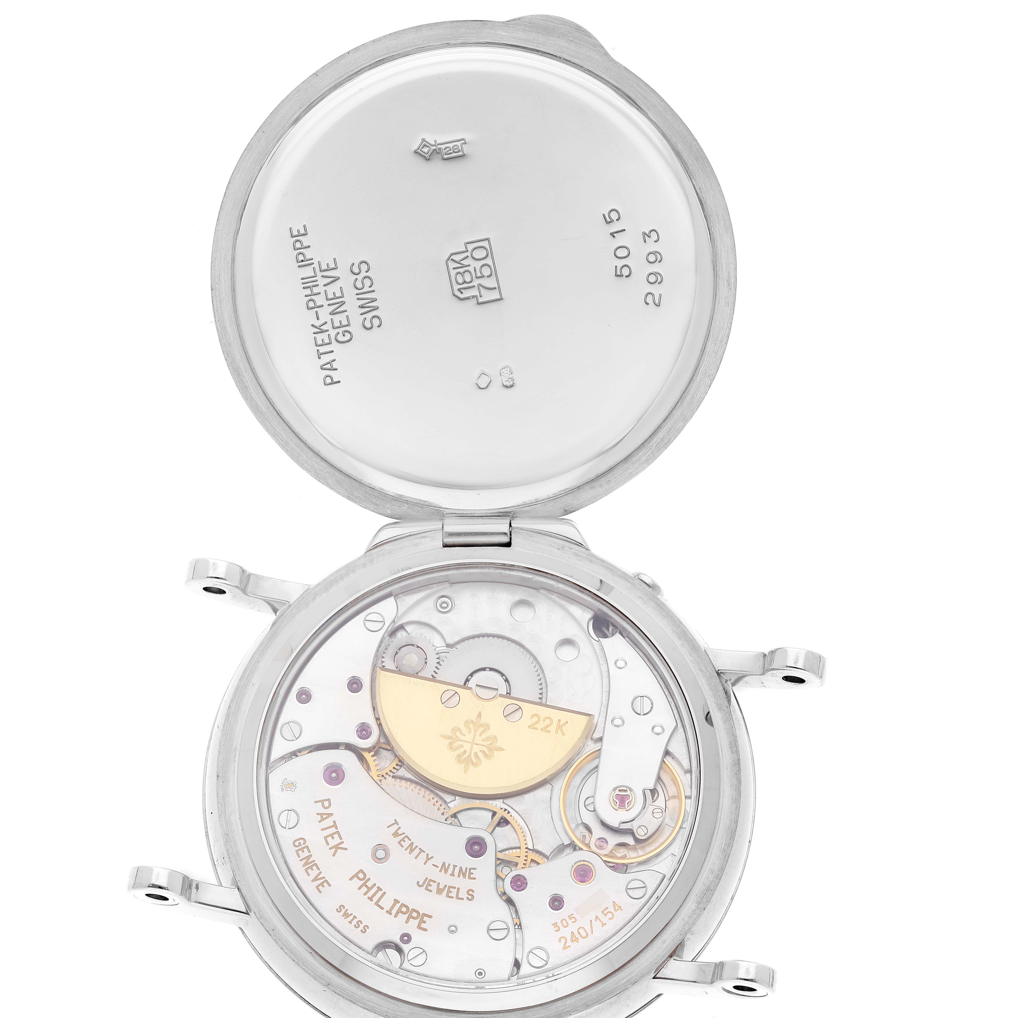 The image shows the open case back of a Patek Philippe Complications 5015G-001 Men's White Gold White Dial watch, revealing its intricate movement inside.