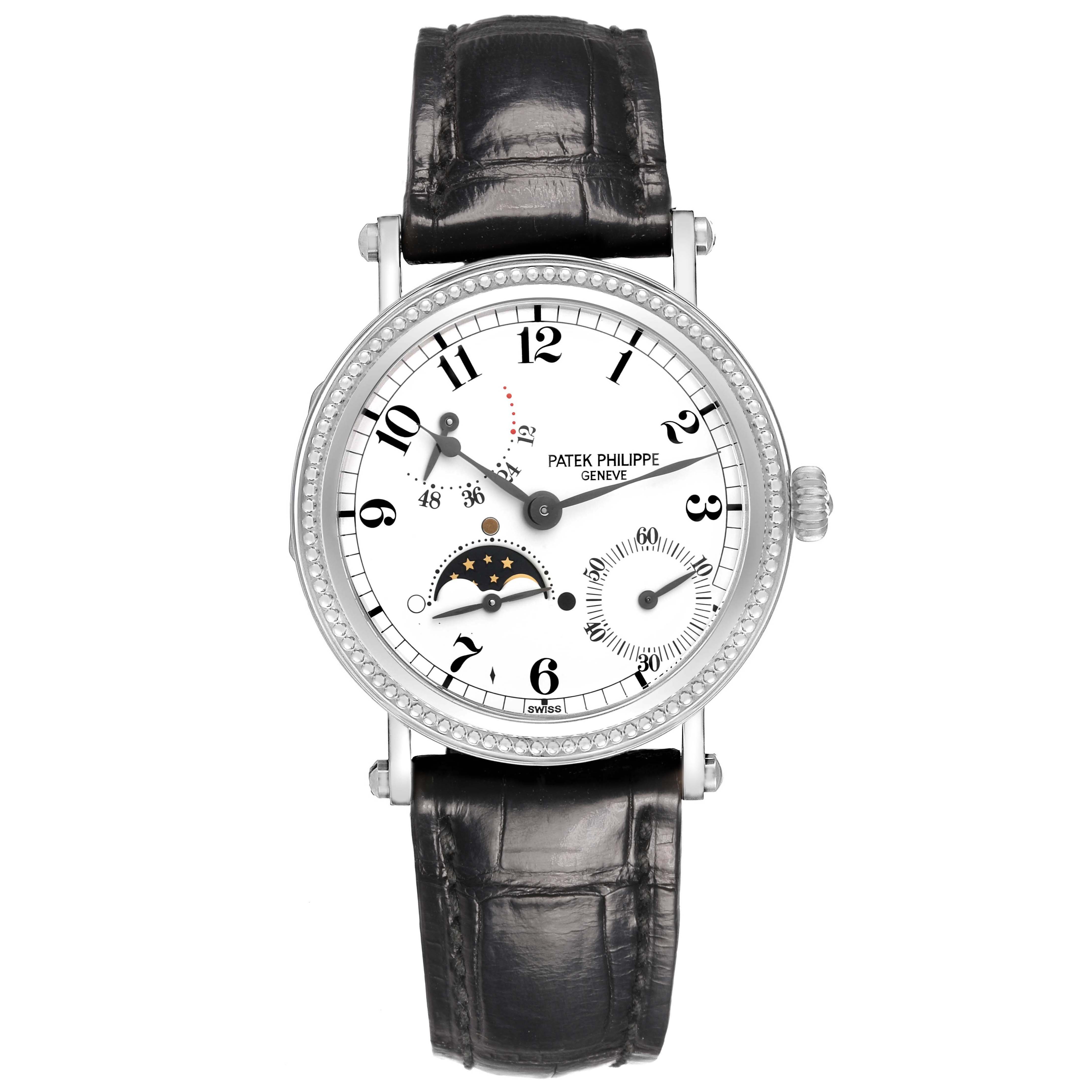 The Patek Philippe Complications 5015G-001 Men's White Gold White Dial watch is shown from a top-down angle, displaying its face, bezel, and black leather strap.