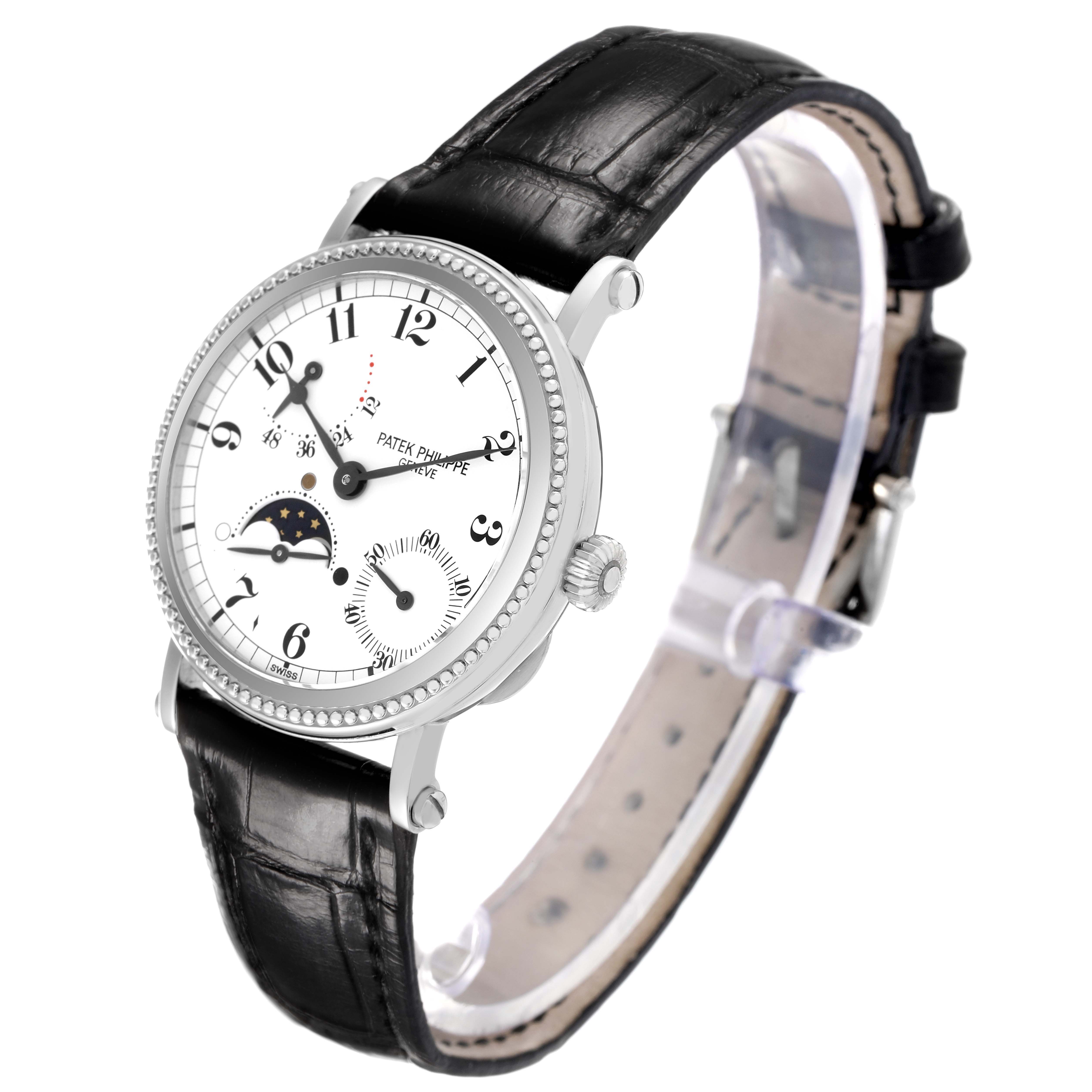 The Patek Philippe Complications 5015G-001 Men's White Gold White Dial watch is shown at a three-quarter angle, displaying the face, bezel, crown, and leather strap.