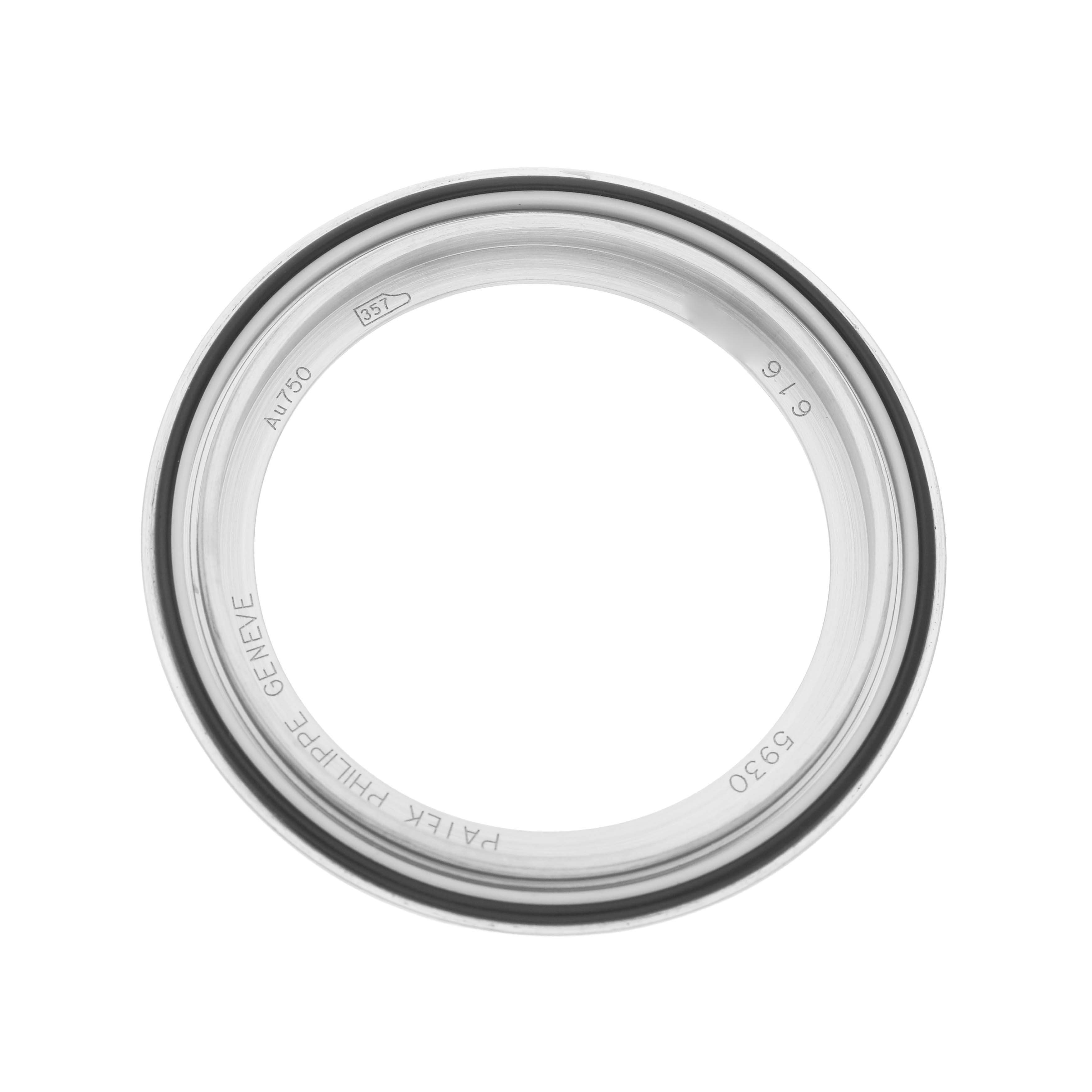 The image shows a top-down view of the bezel of a Patek Philippe Complications 5930G-010 Men's White Gold Blue Dial watch.
