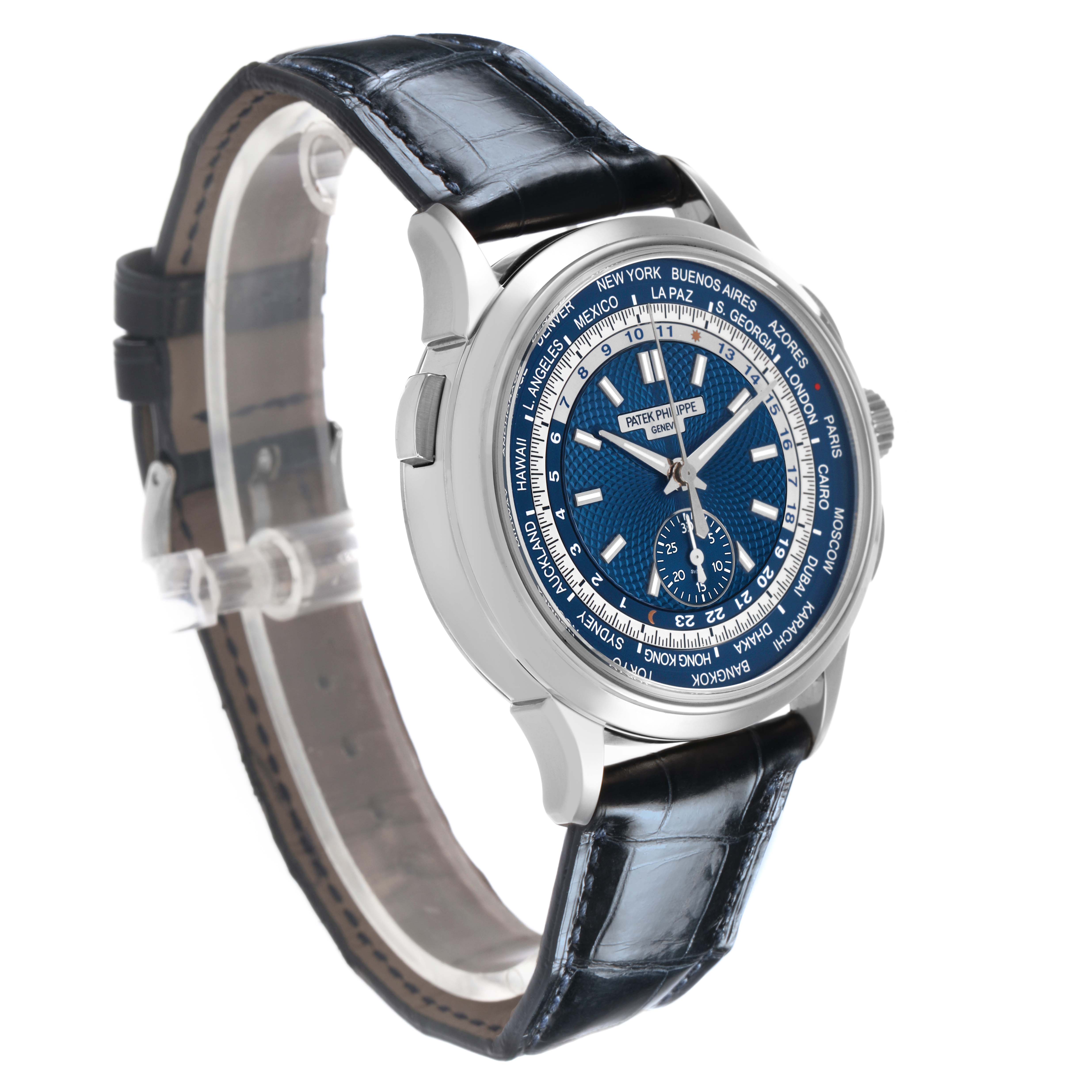 The Patek Philippe Complications 5930G-010 Men's White Gold Blue Dial watch is shown at a three-quarter angle, highlighting the face, bezel, and leather strap.