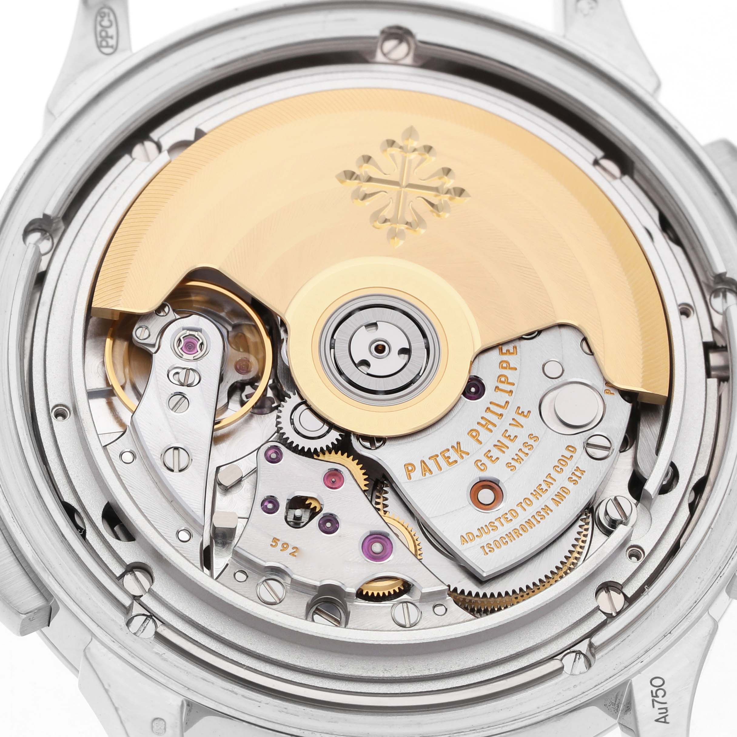 The image shows the back view of the Patek Philippe Complications 5930G-010 Men's White Gold Blue Dial model, highlighting its intricate movement and rotor.